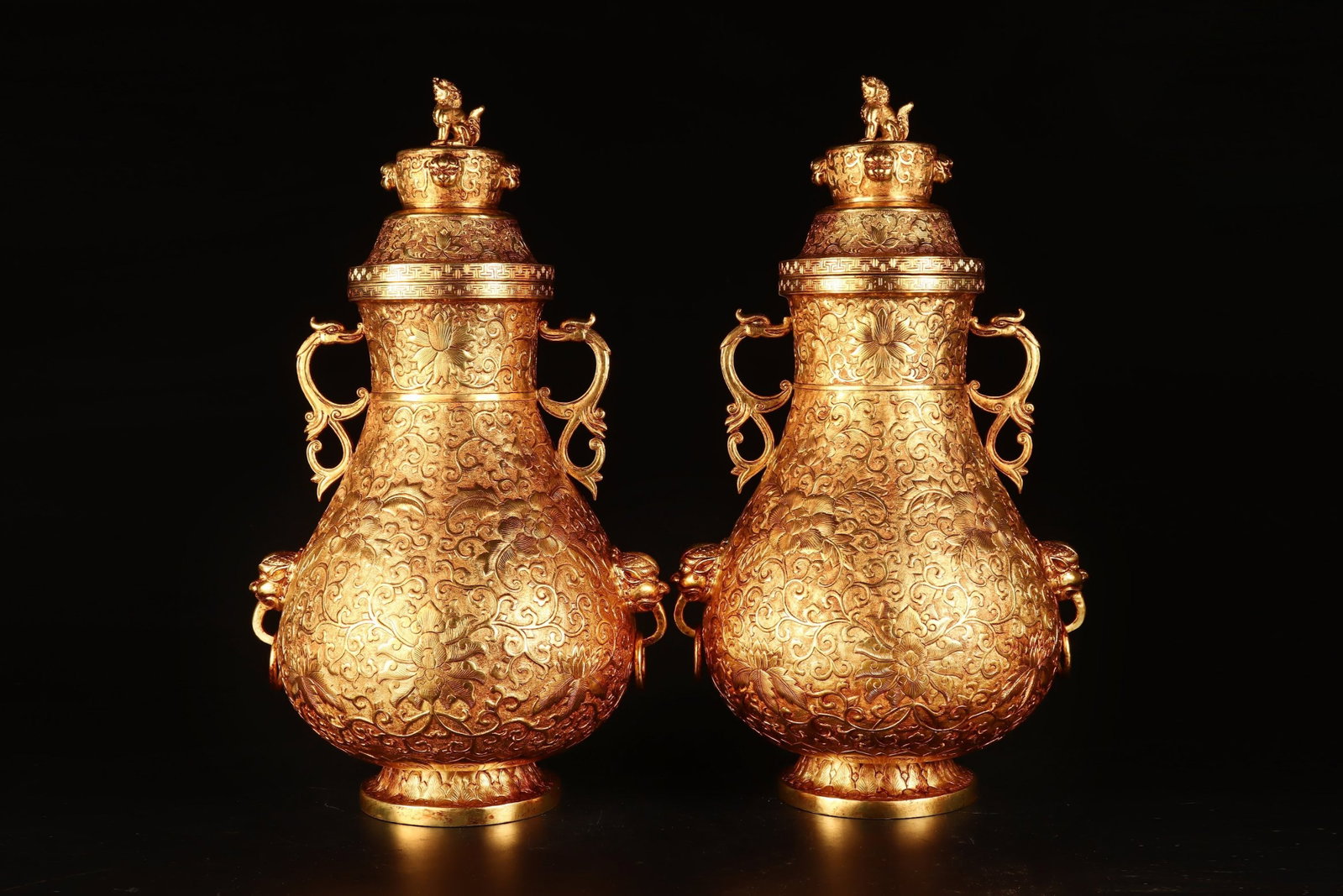 A Pair of Huge Gilt Bronze Lotus Pattern Beast-Ears Bottles: A Pair of Huge Gilt Bronze Lotus Pattern Beast-Ears Bottles,Tang Dynasty,China,Zhenguan Four-character Mark,Size:15.7inx8.7in,Total Weight:4920g 一对铜鎏金缠枝