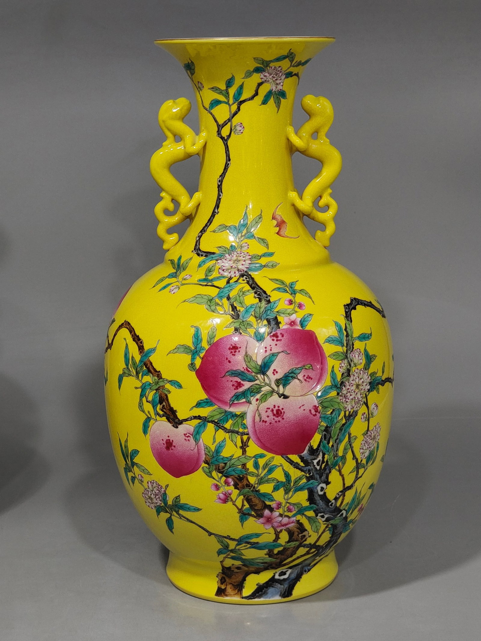 A Huge Yellow Ground Famille-Rose Bats and Peach Pattern Double-Ears Vase: A Huge Yellow Ground Famille-Rose Bats and Peach Pattern Double-Ears Vase,Qing Dynasty,China,Qianlong Six-character Mark,Size:16.7inx9.8in 黄地粉彩蝙蝠桃é