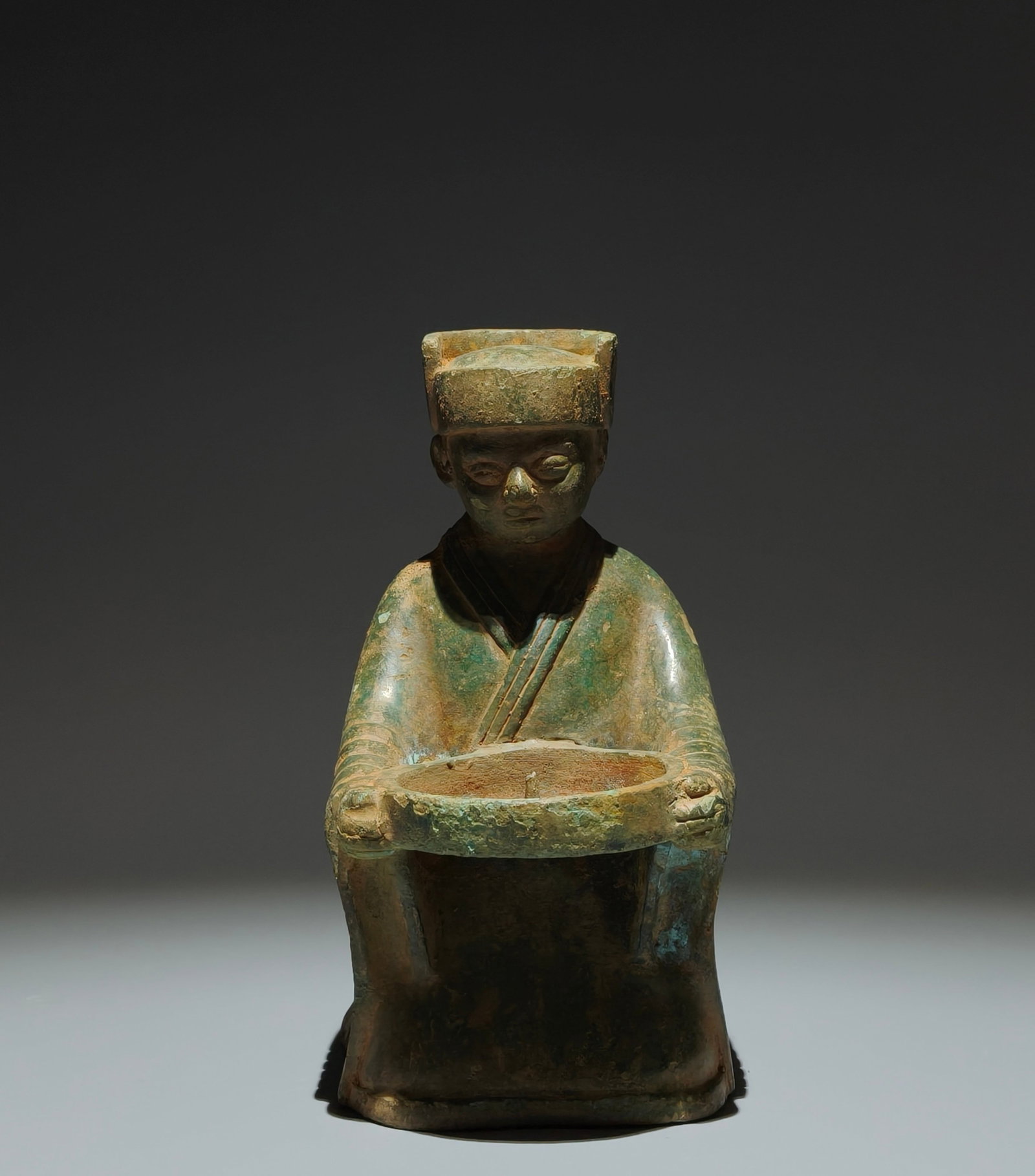 An Archaic Bronze Figure-Shaped Candlestick: An Archaic Bronze Figure-Shaped Candlestick,Han Dynasty,China,Size:8.1inx5.1inx3.9in 青铜人物形烛台,中国汉代