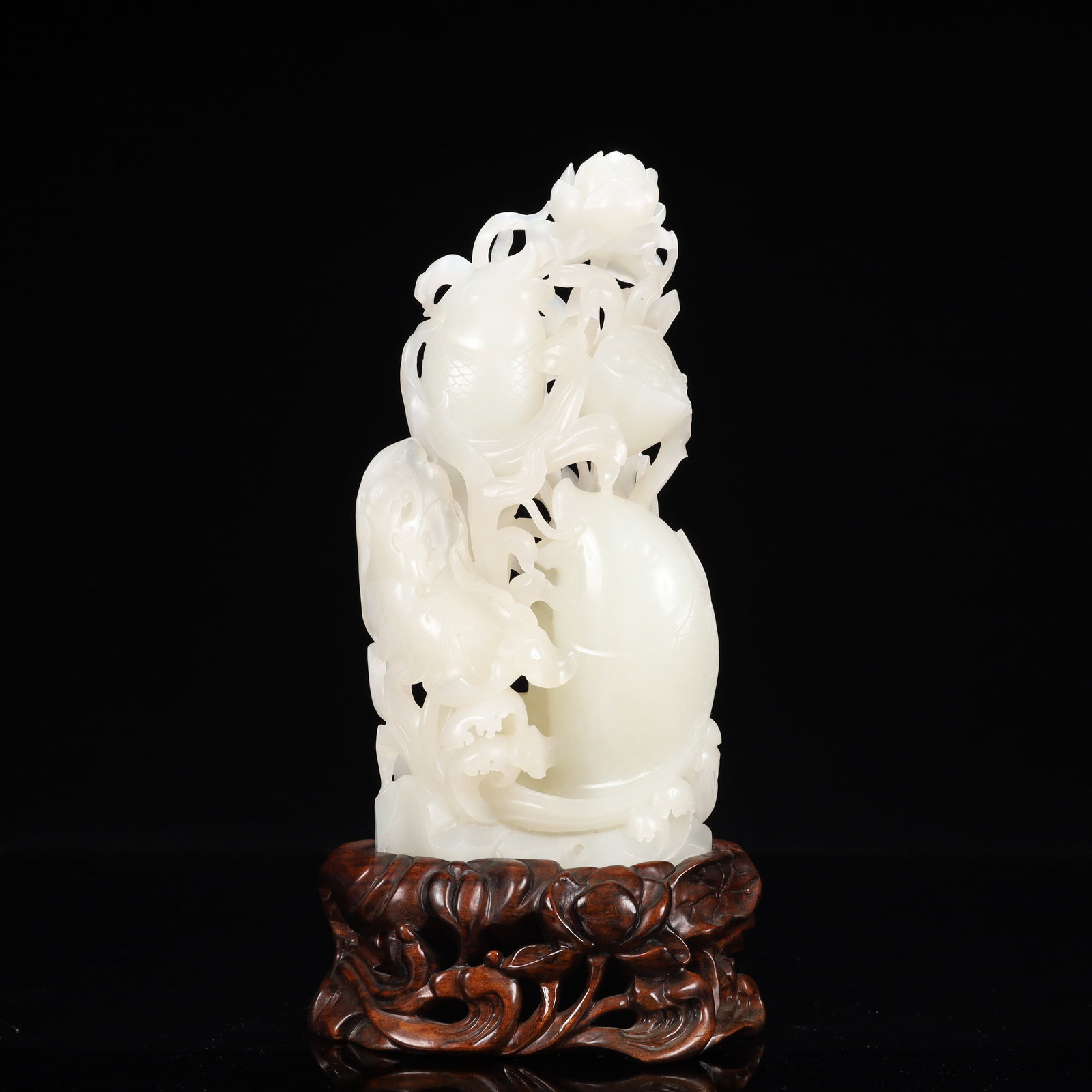 An Exquisite White Jade Lotus and Fish Ornament,With Base: An Exquisite White Jade Lotus and Fish Ornament,With Base,Qing Dynasty, China,Size:4.3inx2.4inx9.1in,Weight:1550g 白玉莲花鱼摆件,带底座,