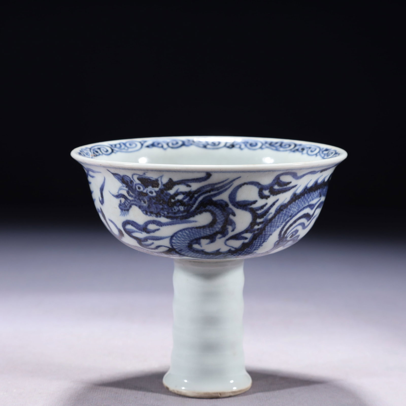 An Exquisite Blue and White Auspicious Cloud and Dragon Pattern Stem Bowl: An Exquisite Blue and White Auspicious Cloud and Dragon Pattern Stem Bowl,Qing Dynasty,China,Size:5.1inx4.7in,Weight:350g 青花祥云龙纹高足碗,È