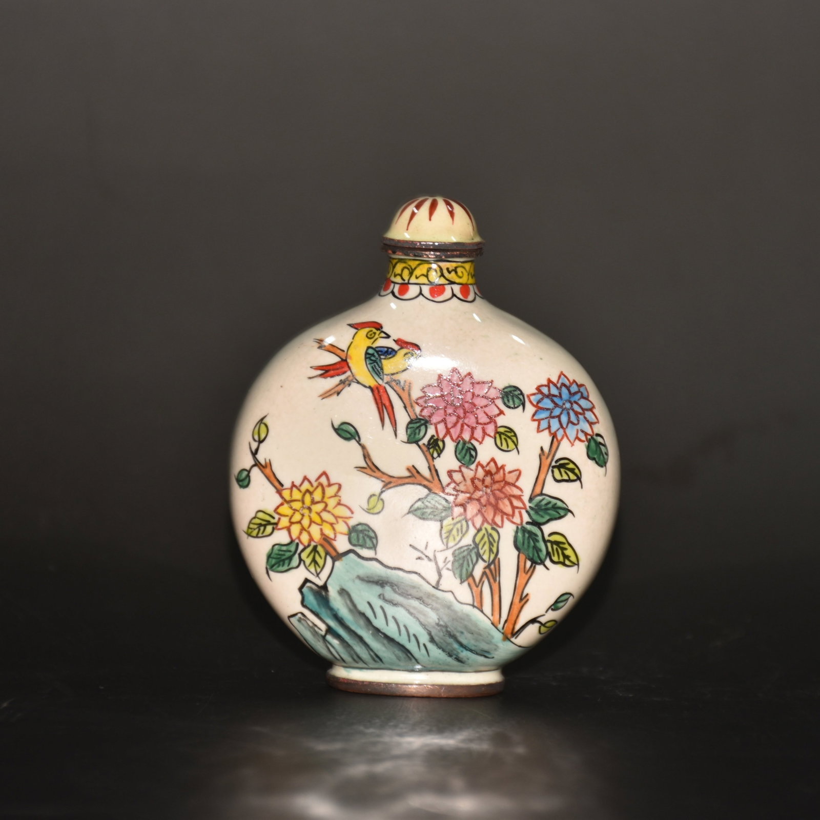 An Exquisite Painted Enamel Flower and Bird Pattern Snuff Bottle: An Exquisite Painted Enamel Flower and Bird Pattern Snuff Bottle,Qing Dynasty,China,Qianlong Four-character Mark,Size:2.4inx0.8inx3.1in,Weight:64g