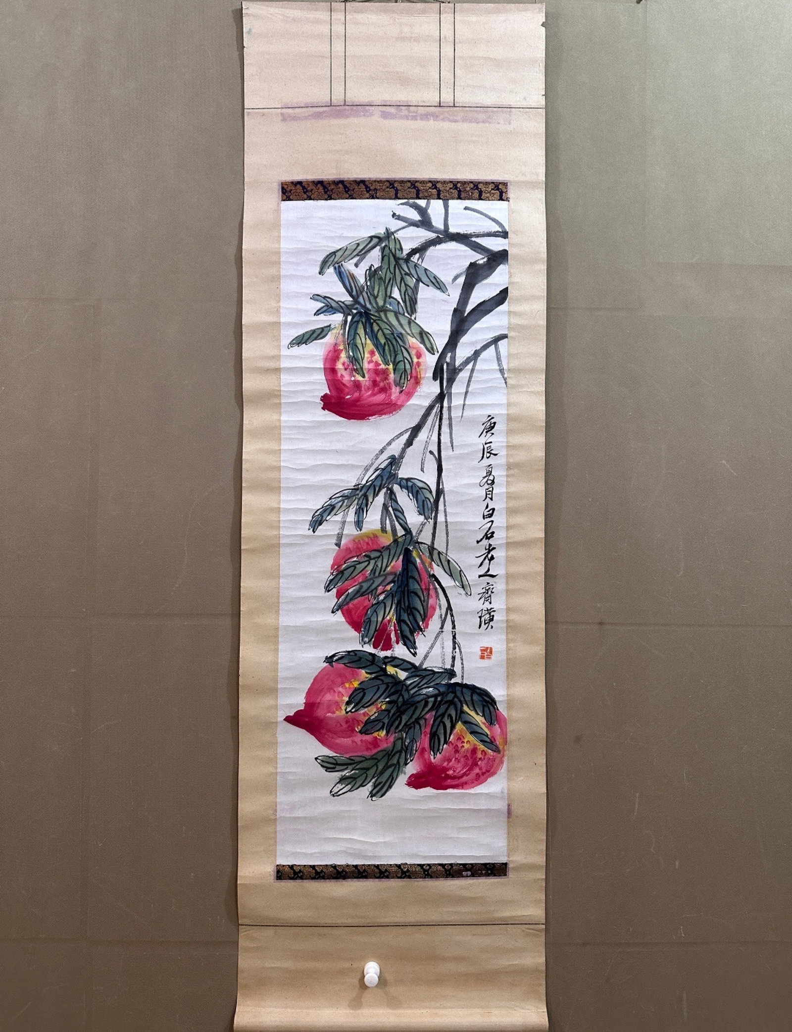 A Chinese Vertical Scroll Ink Painting of Peach on Paper: A Chinese Vertical Scroll Ink Painting of Peach on Paper,Qi Baishi,Size:14.2inx41.3in 一幅中国水墨桃子画立轴,齐白石