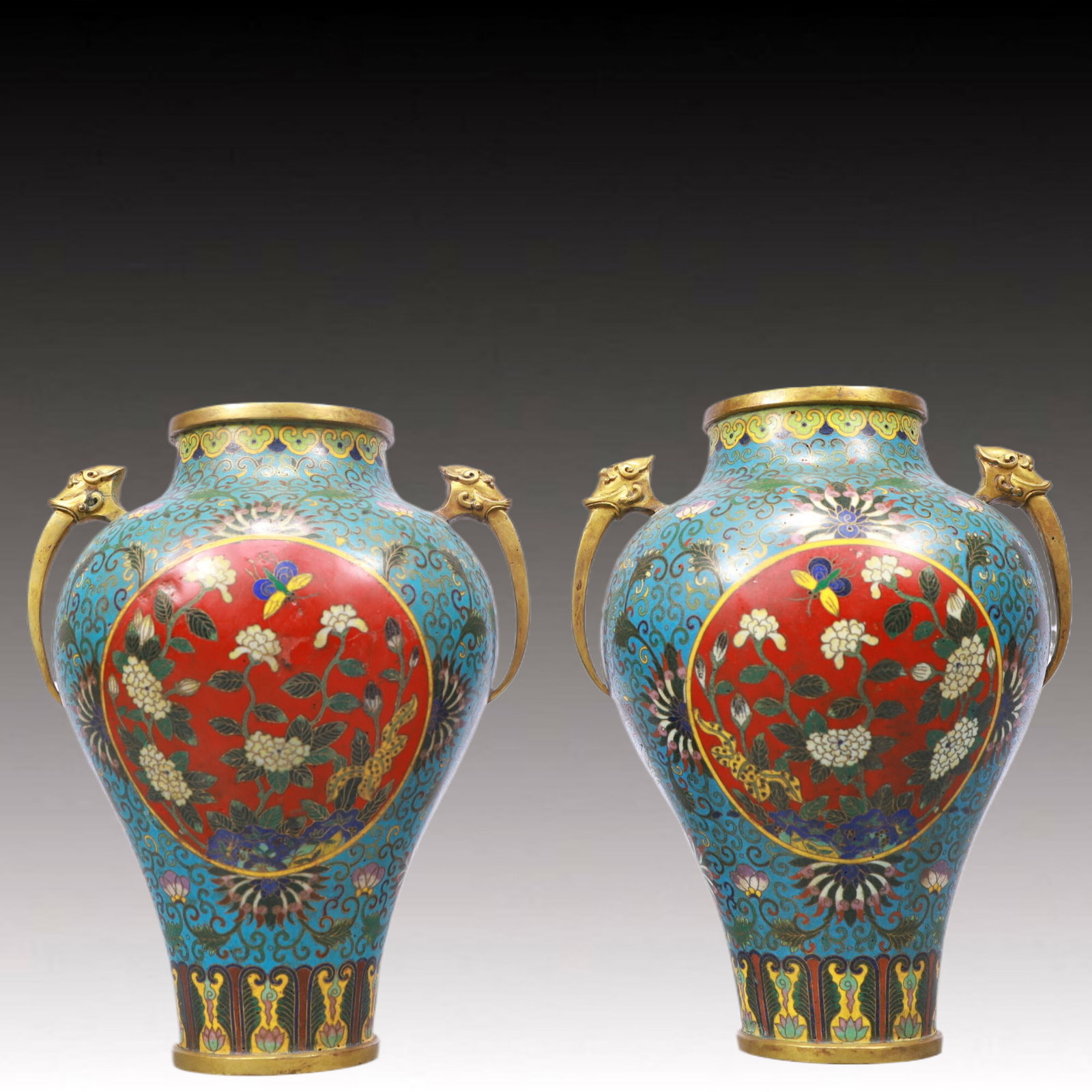 A Pair of Exquisite Cloisonne Lotus and Flower Pattern Double-Ears Vases: A Pair of Exquisite Cloisonne Lotus and Flower Pattern Double-Ears Vases,Qing Dynasty, China,Qianlong Four-character Mark,Size:6.7inx8.7in Weight:2350g 一对景泰蓝缠