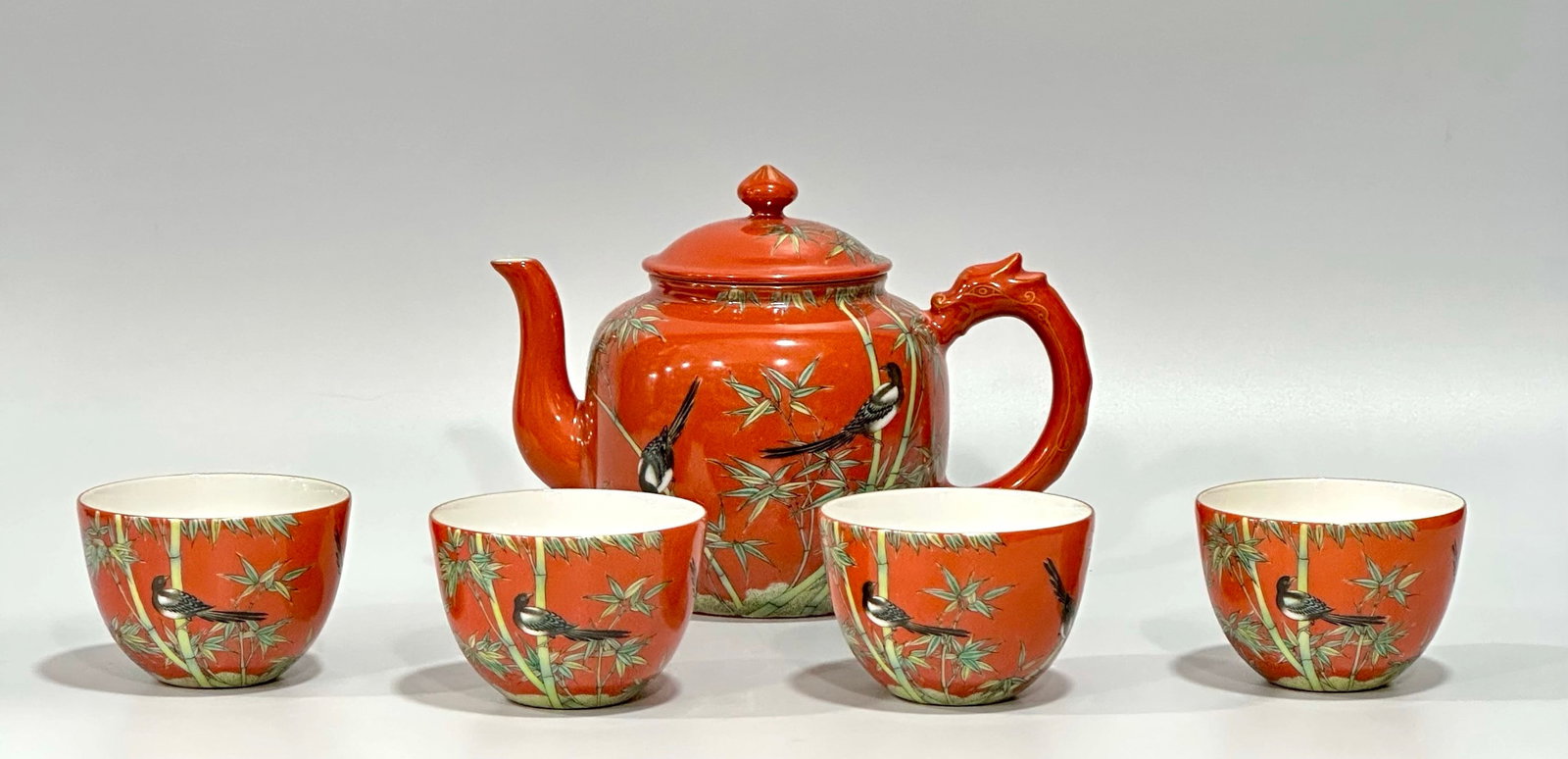 A Set of Fine Famille-Rose Coral Red Glazed Flower and Bird Pattern Tea Set,with Four Cups: A Set of Fine Famille-Rose Coral Red Glazed Flower and Bird Pattern Tea Set,with Four Cups,Qing Dynasty,China,Yongzheng Four-character Mark,Size:(Pot)5.1inx4in,(Cup)2inx2.8in 一套粉&