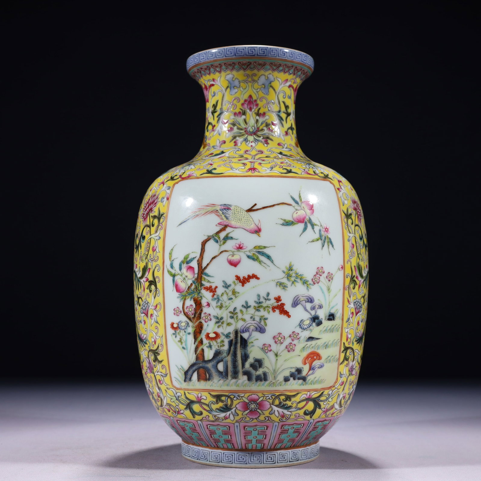 An Exquisite Yellow Ground Famille-Rose Painted Gold Flower and Bird Pattern Vase: An Exquisite Yellow Ground Famille-Rose Painted Gold Flower and Bird Pattern Vase,Qing Dynasty,China,Qianlong Six-character Mark,Size:6.3inx11.4in,Weight:1550g 黄地粉彩描
