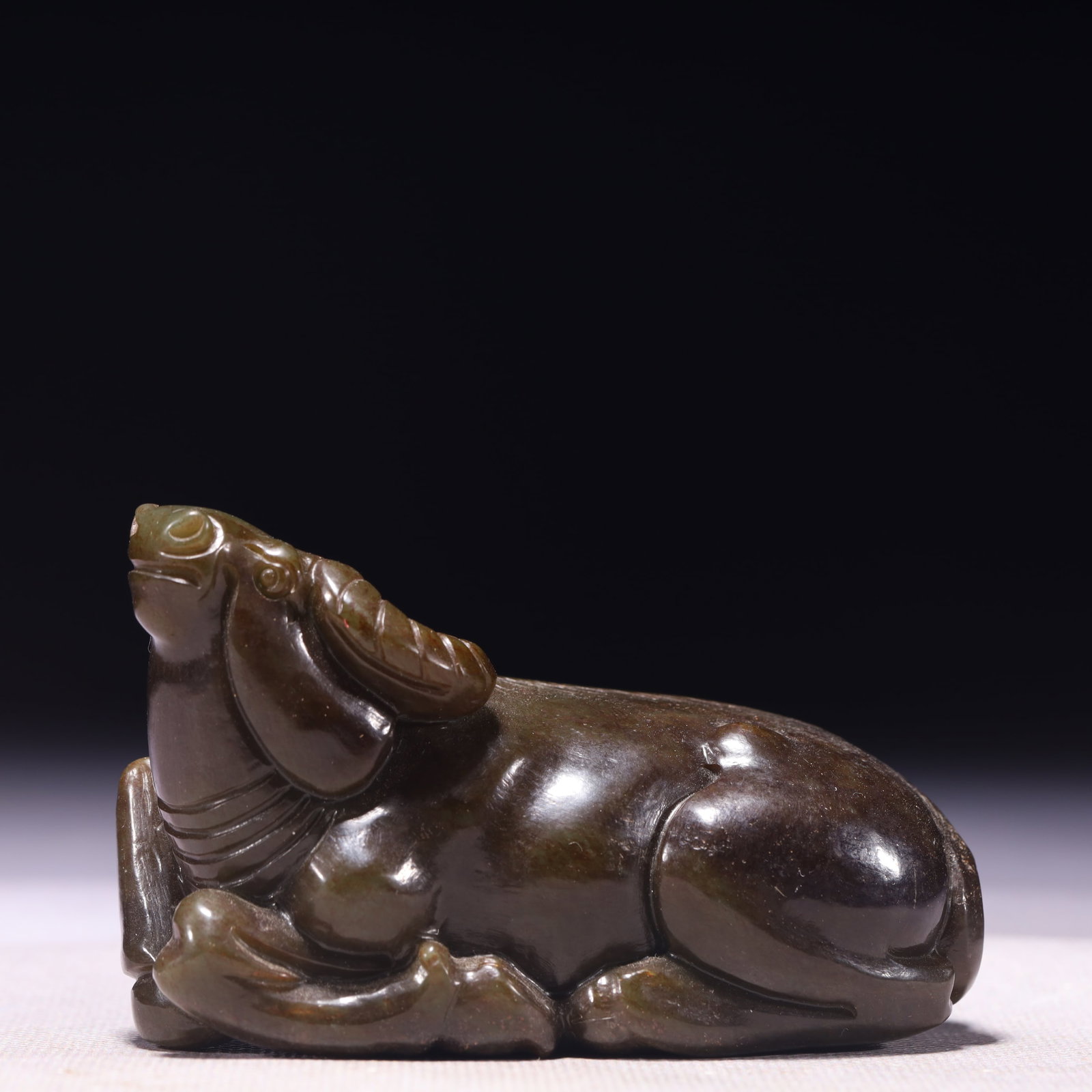 An Exquisite Green Jade Buffalo Ornament: An Exquisite Green Jade Buffalo Ornament,Qing Dynasty,China,Size:3.5inx2inx2.4in,Weight:345g 青玉牛摆件,中国清代