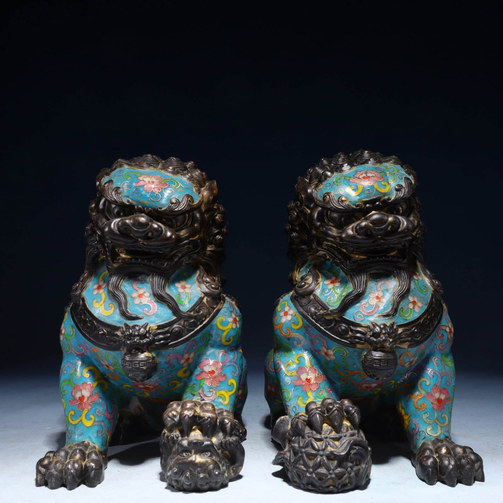 A Pair of Exquisite Cloisonne Lotus Pattern Lion Ornaments: A Pair of Exquisite Cloisonne Lotus Pattern Lion Ornaments,Qing Dynasty,China,Qianlong Four-character Mark,Size:9.4inx5.1inx9.1in,Weight:9550g