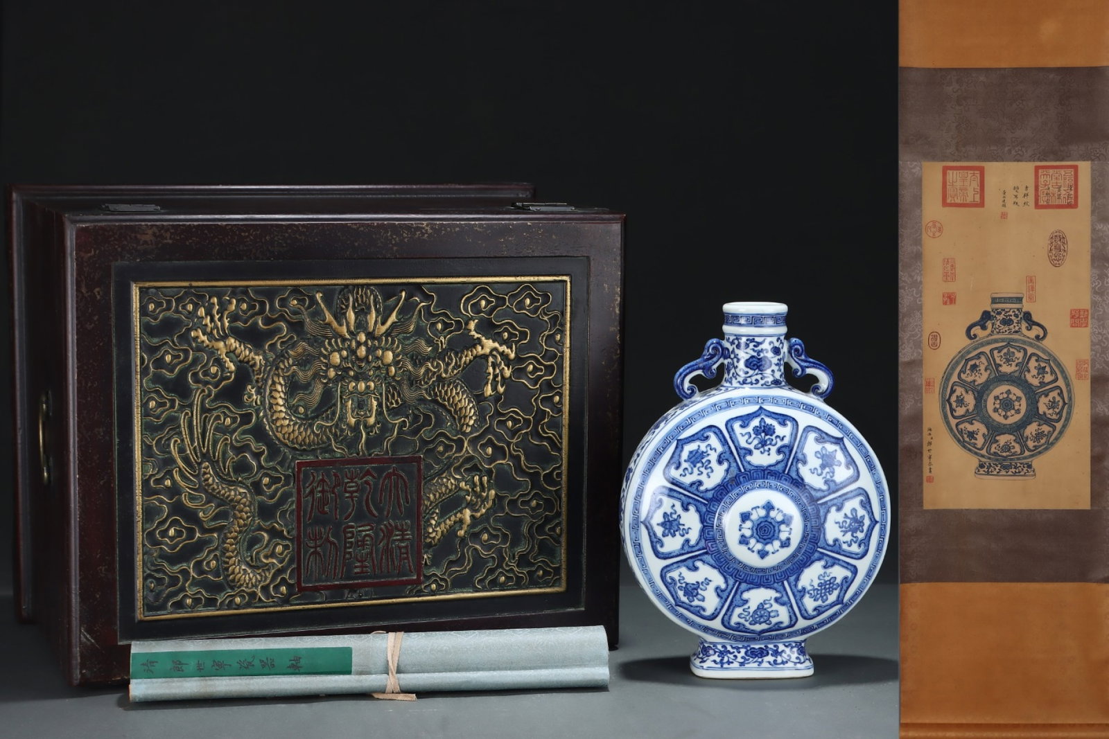 A Rare Blue and White Eight Treasures Pattern Double-Ears Vase,with Chinese Vertical Scroll Ink: A Rare Blue and White Eight Treasures Pattern Double-Ears Vase,with Chinese Vertical Scroll Ink Painting on Silk,Qing Dynasty,China,Qianlong Six-character Mark,Size:(Silk)25.2inx12.2in,(Porcelain)12.7