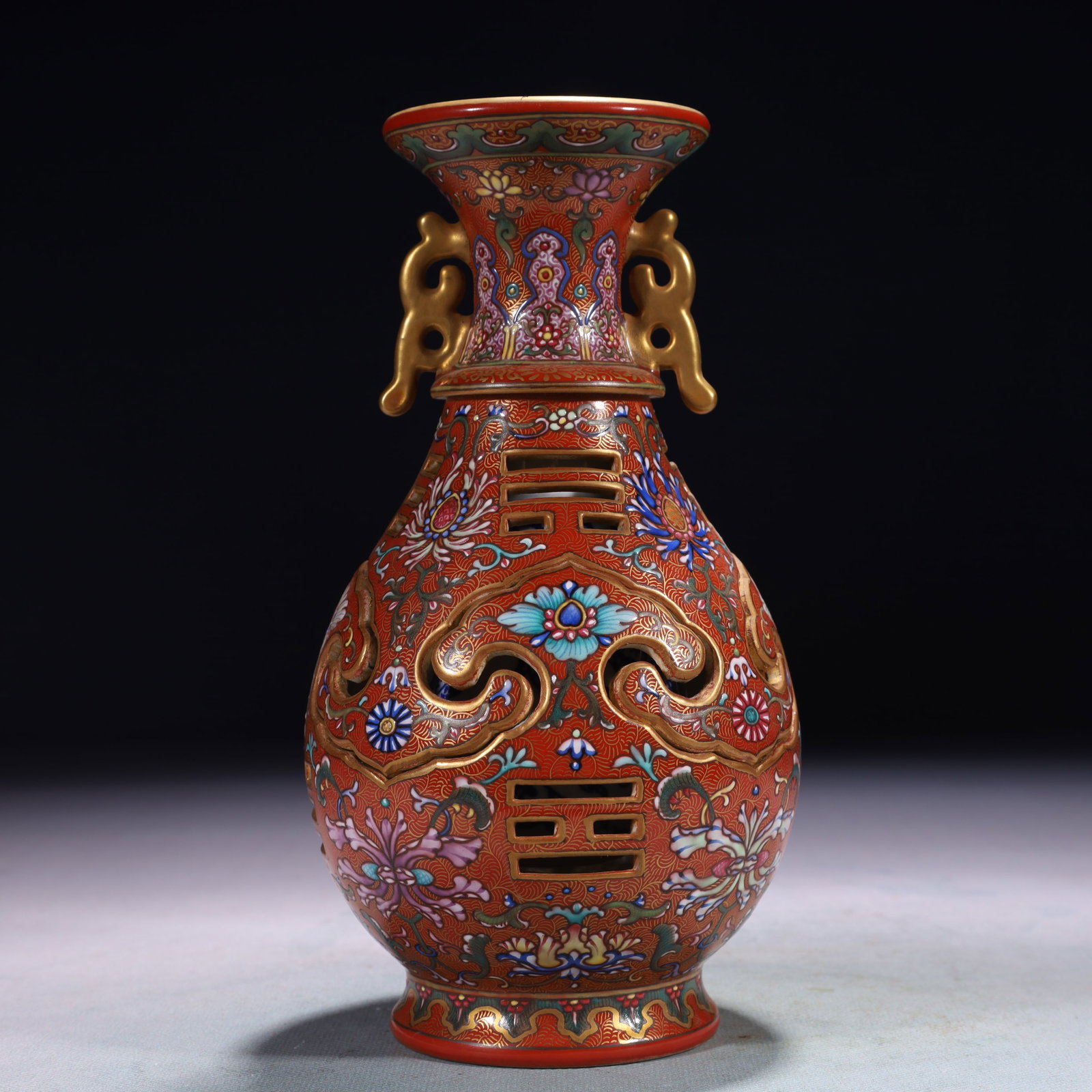 An Exquisite Red Ground Famille-Rose Lotus Pattern Double-Ears Vase: An Exquisite Red Ground Famille-Rose Lotus Pattern Double-Ears Vase,Qing Dynasty,China,Qianlong Six-character Mark,Size:7.9inx8.3in,Weight:750g