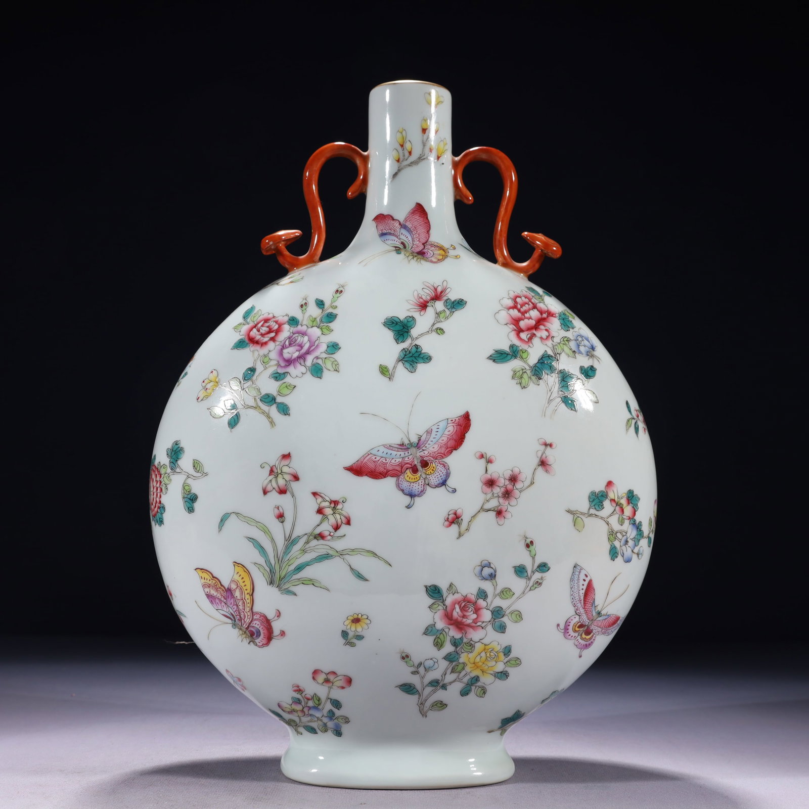 An Exquisite Famille-Rose Painted Gold Flower and Butterfly Pattern Double-Ears Vase: An Exquisite Famille-Rose Painted Gold Flower and Butterfly Pattern Double-Ears Vase,Qing Dynasty,China,Qianlong Six-character Mark,Size:9.8inx4.3inx13.8in,Weight:2650g 粉彩描金