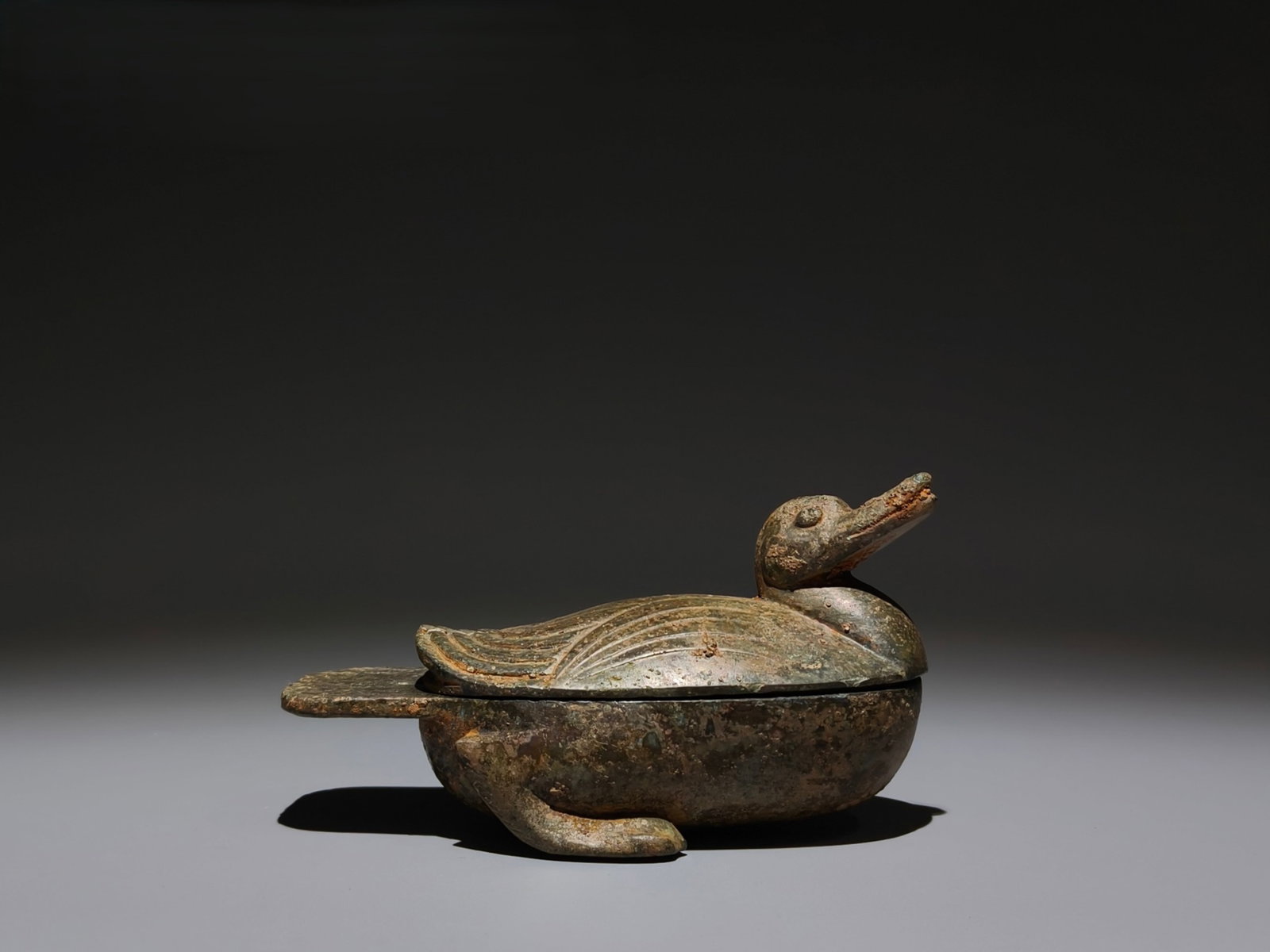 An Archaic Bronze Duck Box with Cover: An Archaic Bronze Duck Box with Cover,Han Dynasty,China,Size:3.3inx5.7inx3in 青铜鸭盖盒,中国汉代