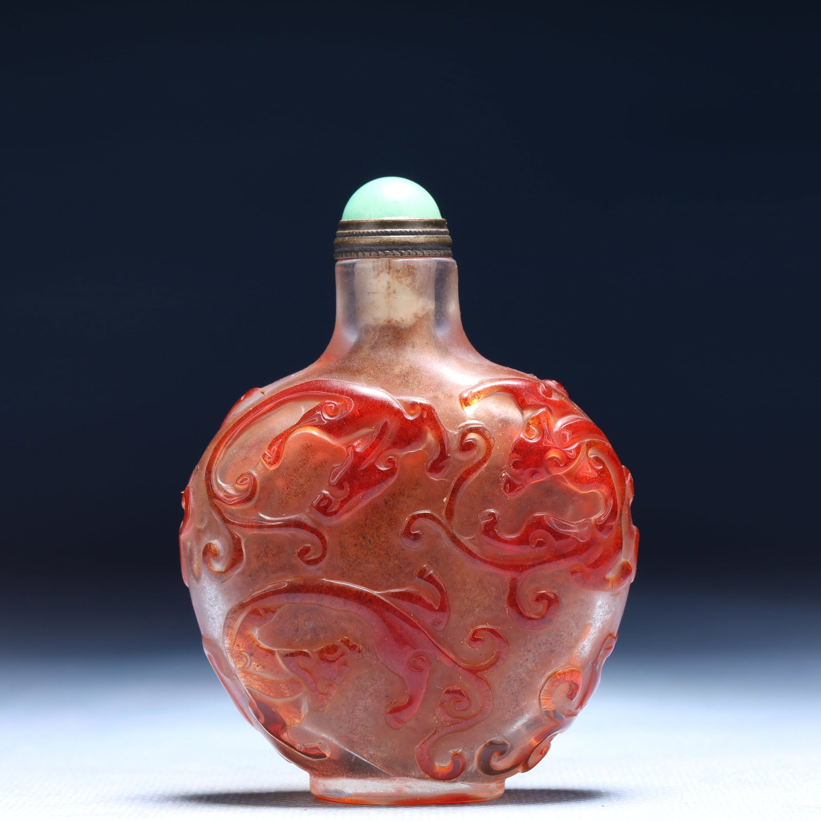 An Exquisite Glass Chi-Dragon Pattern Snuff Bottle: An Exquisite Glass Chi-Dragon Pattern Snuff Bottle,Qing Dynasty,China,Size:2.2inx1inx3in,Weight:68g 琉璃螭龙纹鼻烟壶,中国清代