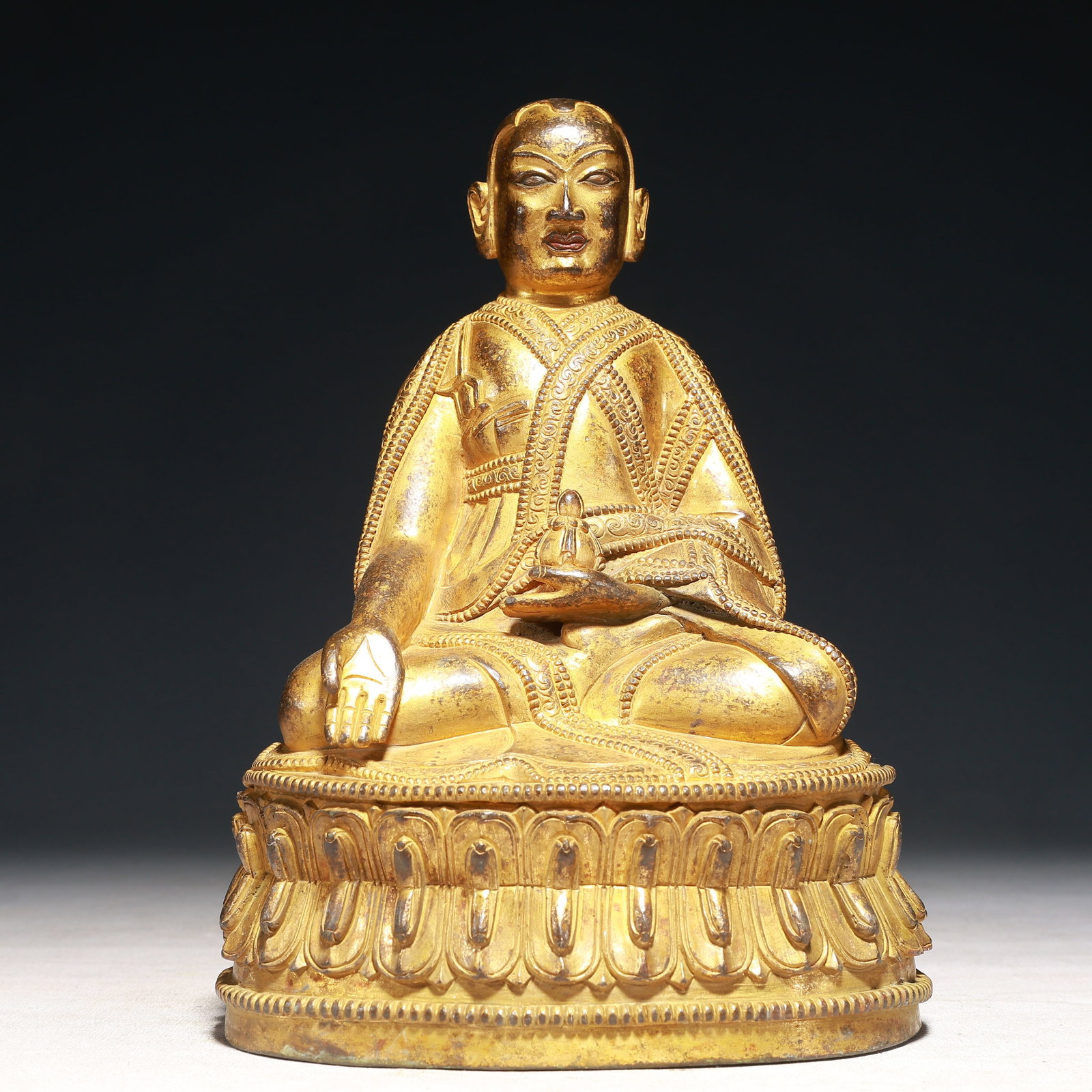 A Solemn Gilt Bronze Statue of Guru: A Solemn Gilt Bronze Statue of Guru,Qing Dynasty,China,Size:6.3inx4.3inx9.1in,Weight:2700g 铜鎏金上师像,中国清代