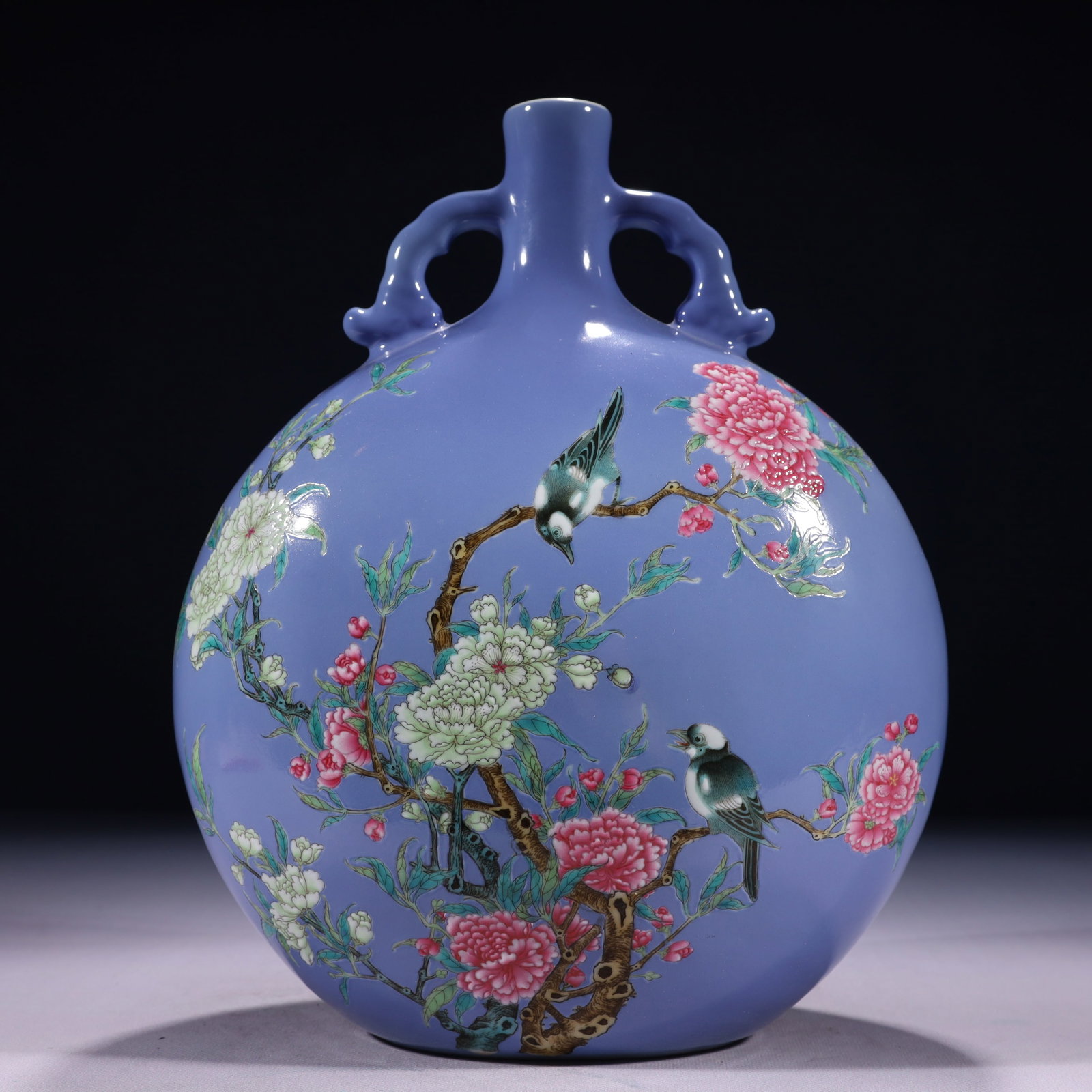 An Exquisite Blue Ground Famille-Rose Flower and Bird Pattern Double-Ears Vase: An Exquisite Blue Ground Famille-Rose Flower and Bird Pattern Double-Ears Vase,Qing Dynasty,China,Yongzheng Six-character Mark,Size:9.1inx5.1inx12.6in,Weight:3200g