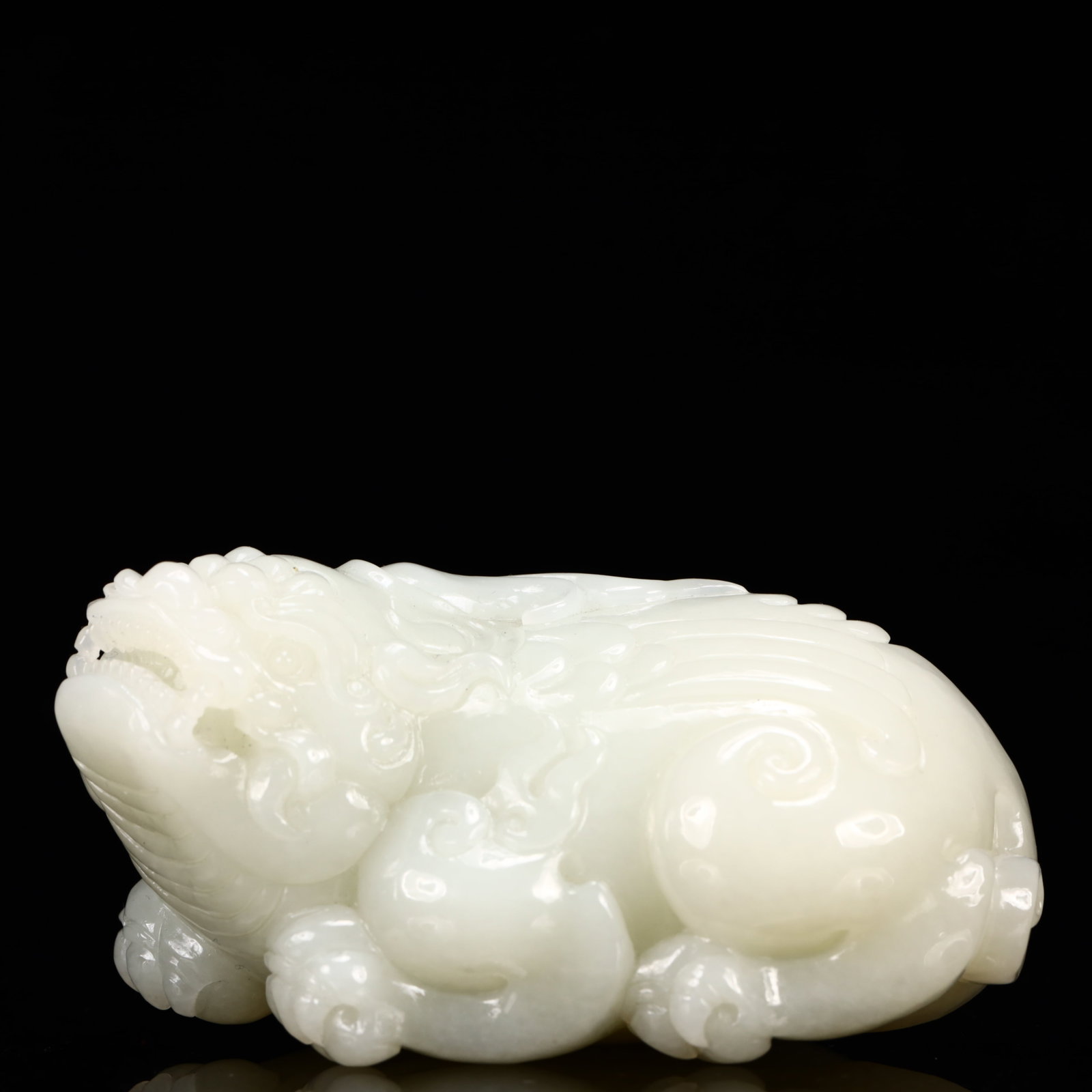 An Exquisite White Jade Auspicious Beast Ornament: An Exquisite White Jade Auspicious Beast Ornament,Qing Dynasty, China,Size:3.5inx2.4inx2in,Weight:368g 白玉瑞兽摆件,中国清代