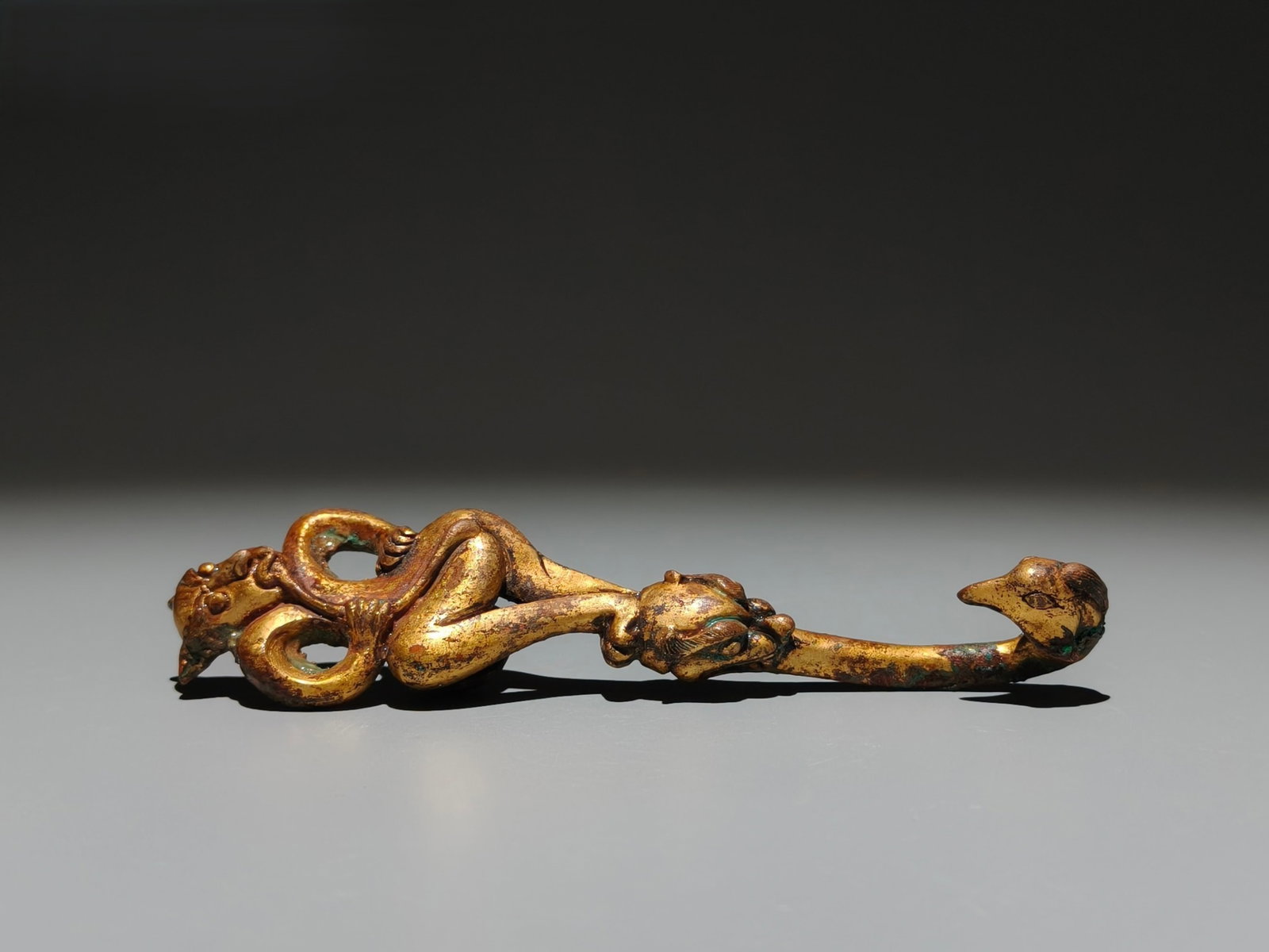 An Exquisite Gilt Bronze Beast Ornament: An Exquisite Gilt Bronze Beast Ornament,the Warring States period in China,Size:5.9inx1.5in 铜鎏金兽摆件,中国战国时期