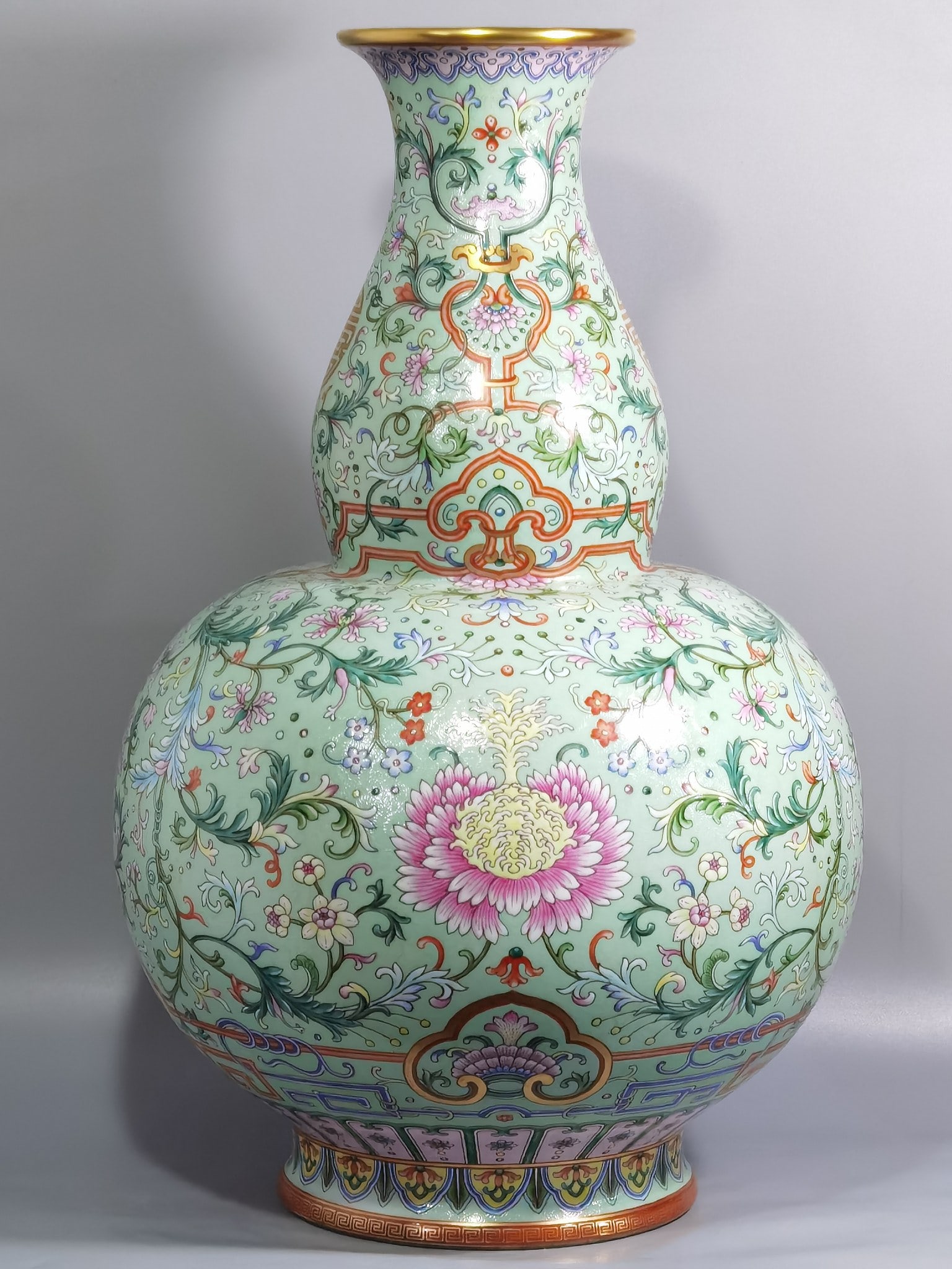 A Huge Green Ground Famille-Rose Painted Gold Lotus Pattern Gourd-Shaped Vase: A Huge Green Ground Famille-Rose Painted Gold Lotus Pattern Gourd-Shaped Vase,Qing Dynasty,China,Qianlong Six-character Mark,Size:22.3inx14.4in 绿地粉彩描金缠