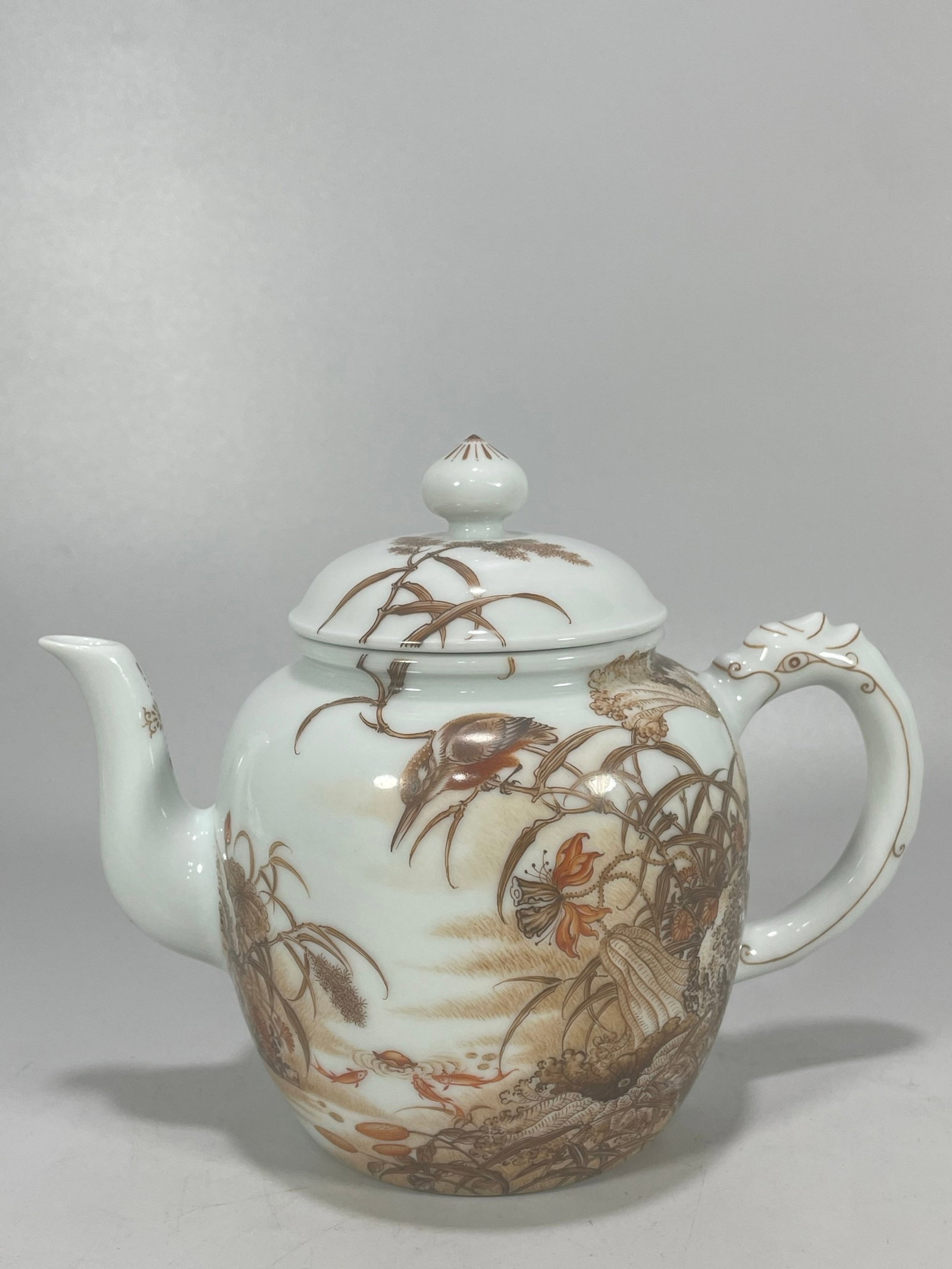An Exquisite Ink Color Flower and Bird Pattern Teapot,with poem: An Exquisite Ink Color Flower and Bird Pattern Teapot,with poem,Qing Dynasty,China,Yongzheng Six-character Mark,Size:5.1inx6.3in 墨彩花鸟纹茶壶,带෻