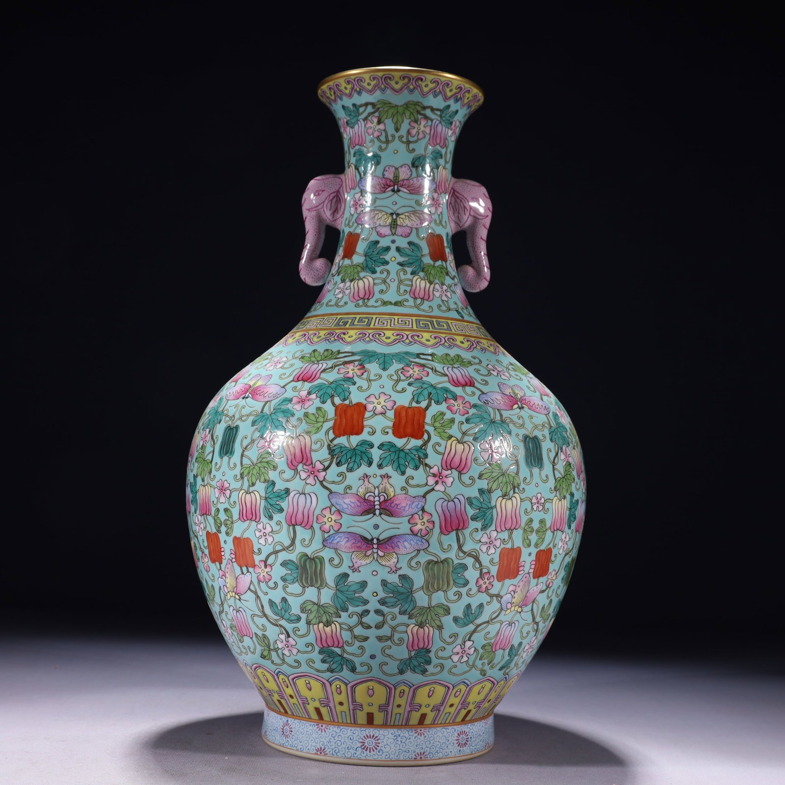 An Exquisite Turquoise Glazed Famille-Rose Painted Gold Flower and Butterfly Pattern Double-Ears: An Exquisite Turquoise Glazed Famille-Rose Painted Gold Flower and Butterfly Pattern Double-Ears Vase,Qing Dynasty,China,Qianlong Six-character Mark,Size:7.9inx14.2in,Weight:2450g 松石 