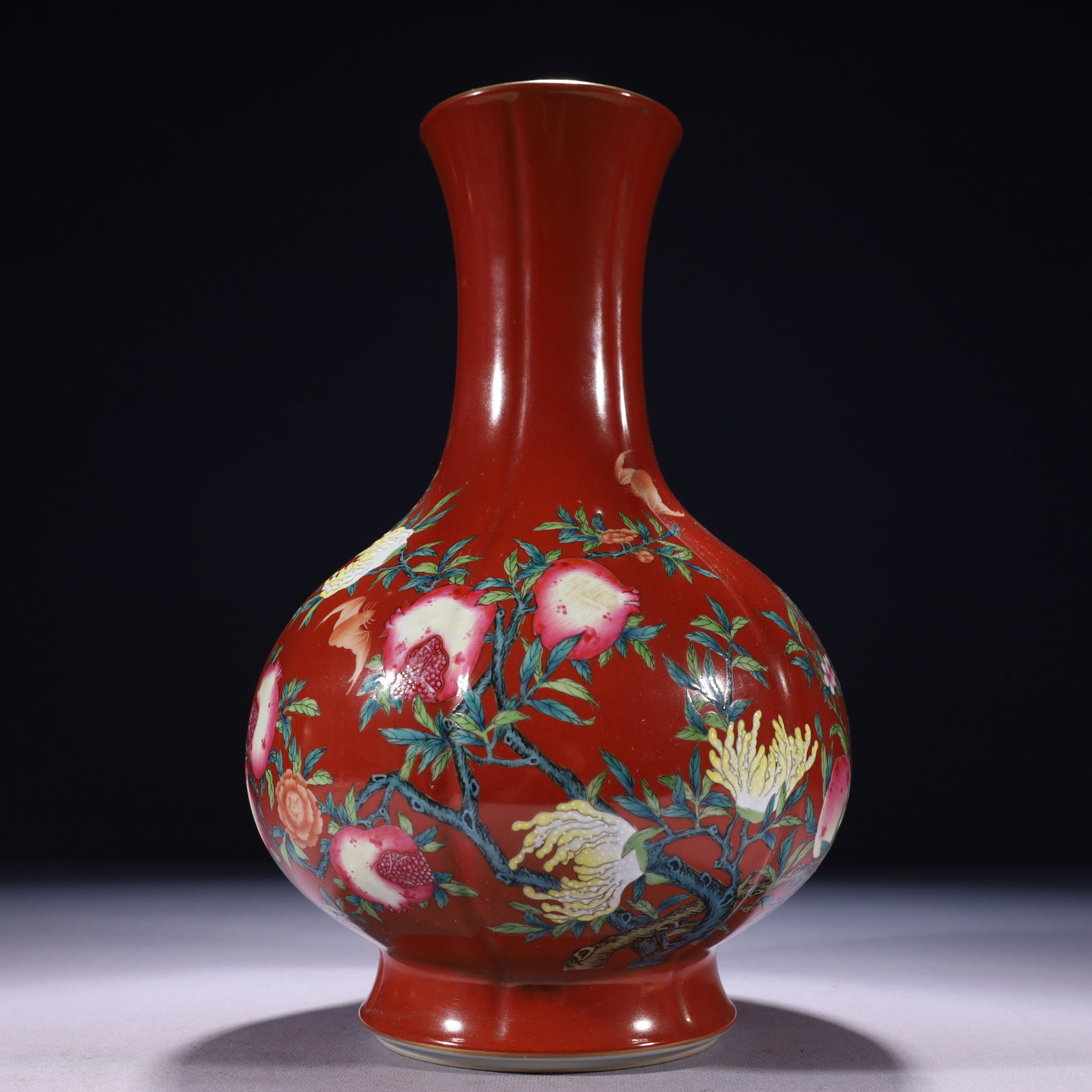 An Exquisite Red Ground Famille-Rose Painted Gold Flower and Fruit Pattern Vase: An Exquisite Red Ground Famille-Rose Painted Gold Flower and Fruit Pattern Vase,Qing Dynasty,China,Qianlong Six-character Mark,Size:7.1inx12.6in,Weight:2150g 红地粉彩描&#