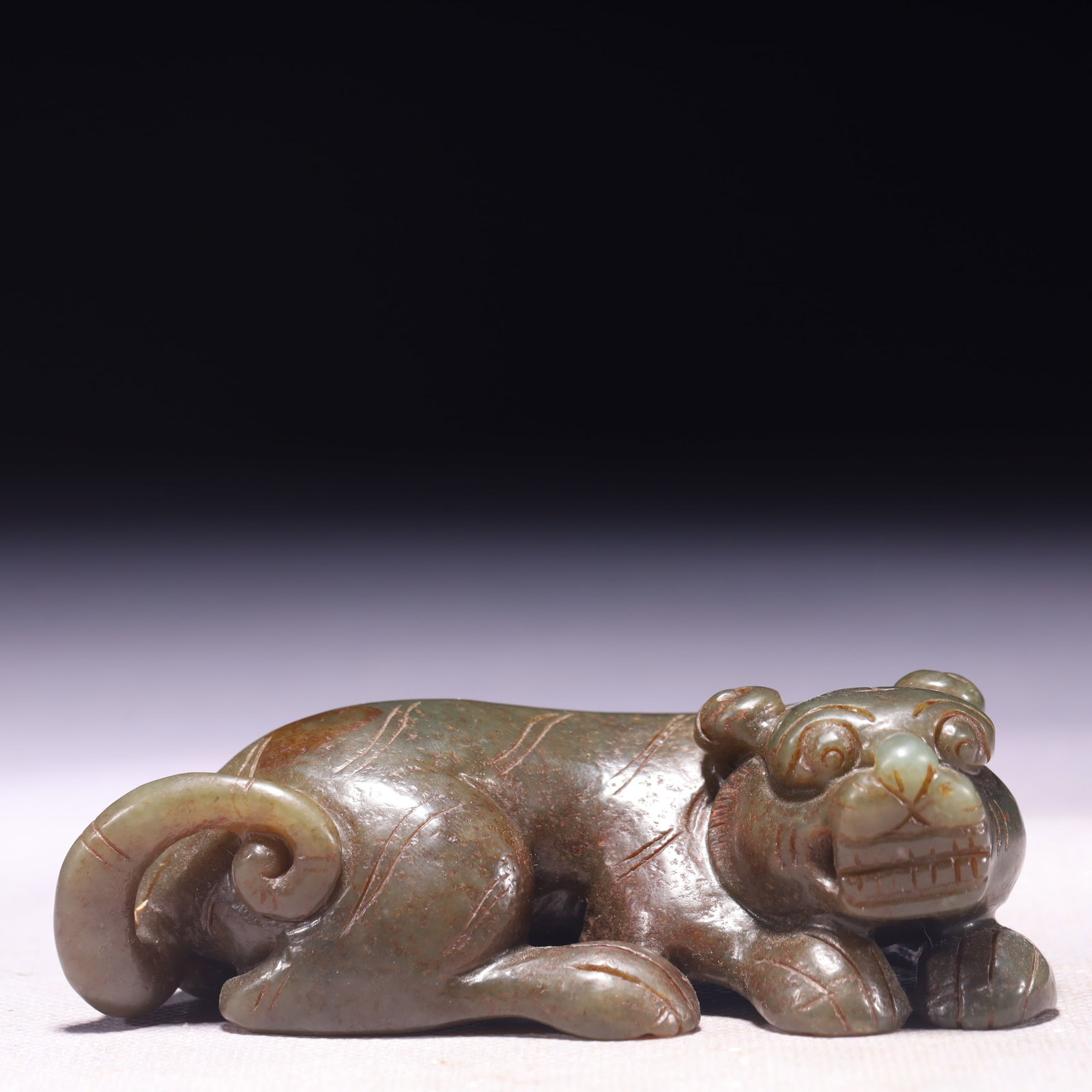 An Exquisite Green Jade Tiger Ornament: An Exquisite Green Jade Tiger Ornament,Qing Dynasty,China,Size:4.1inx2inx1.4in,Weight:248g 青玉老虎摆件,中国清代