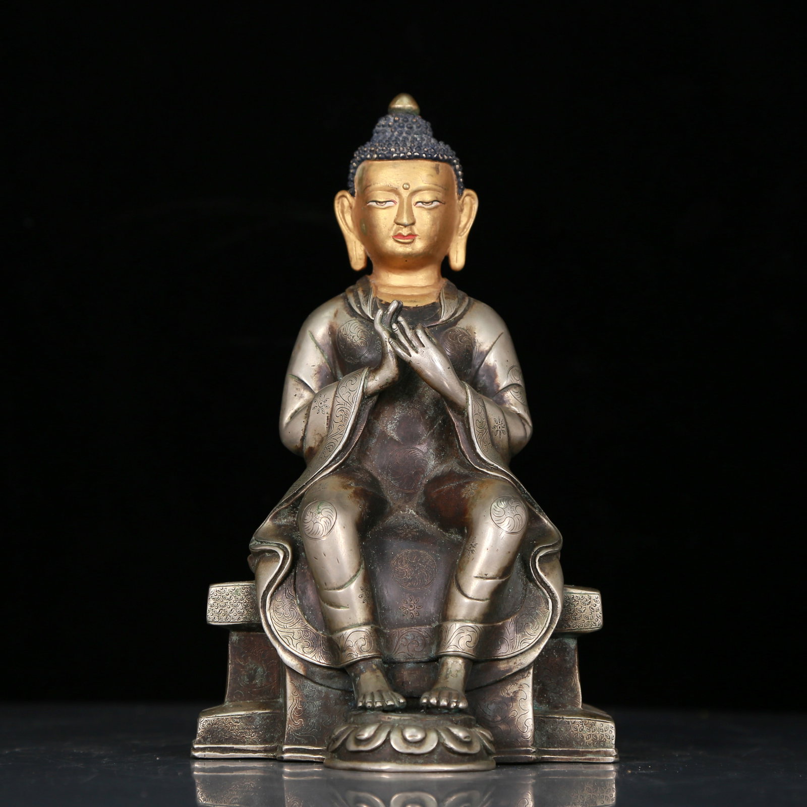 An Excellent Gilt-Bronze Silver Figure Of Buddha Shakyamuni With Inscriptions: An Excellent Gilt-Bronze Silver Figure Of Buddha Shakyamuni With Inscriptions. Superbly and sensitively sculpted in the form of a seated Buddha Shakyamuni, with well-defined arched eyebrows juxtaposed