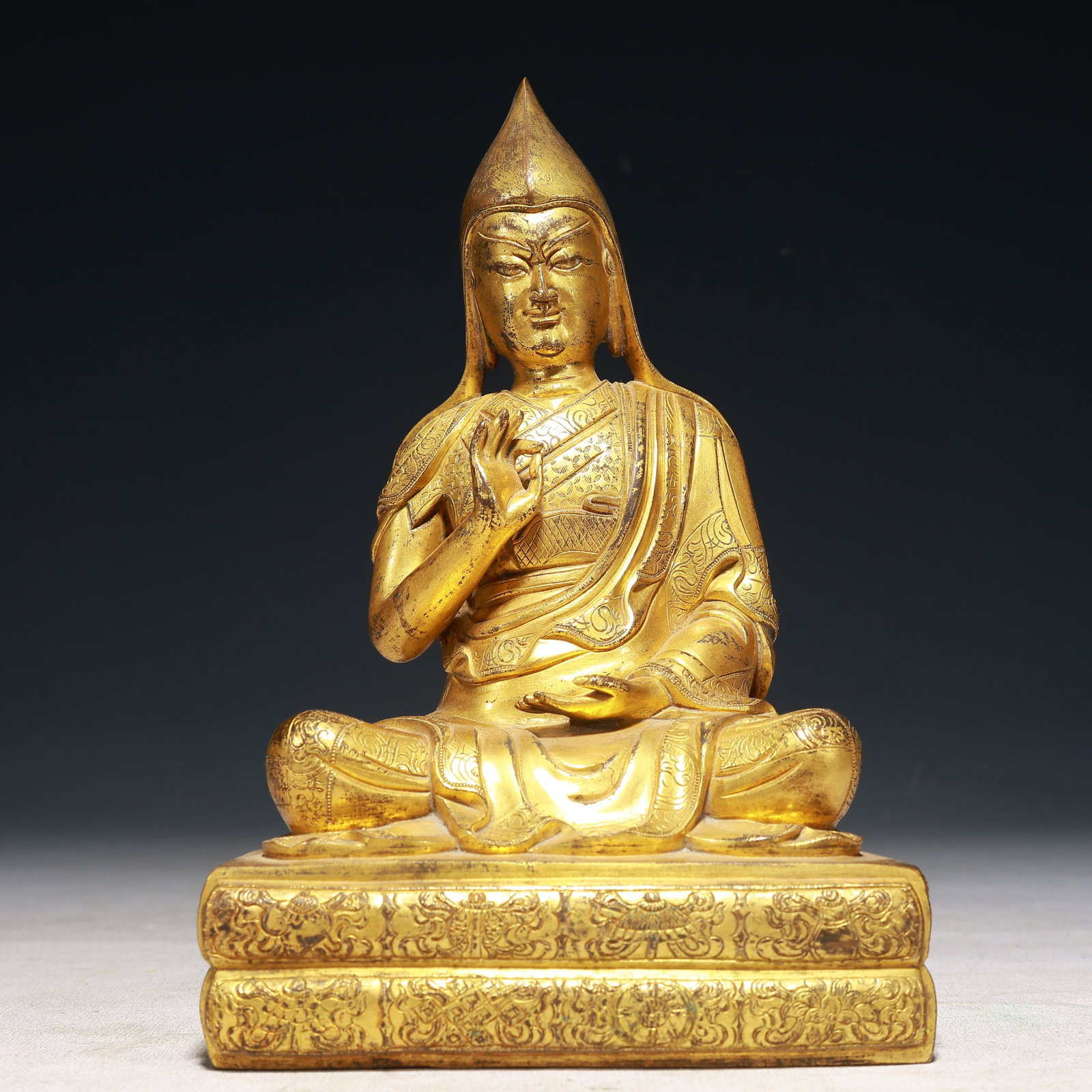 A Solemn Gilt Bronze Eight Treasures Pattern Statue of Tsongkhapa: A Solemn Gilt Bronze Eight Treasures Pattern Statue of Tsongkhapa,Qing Dynasty,China,Size:5.5inx4.1inx8.7in,Weight:2050g