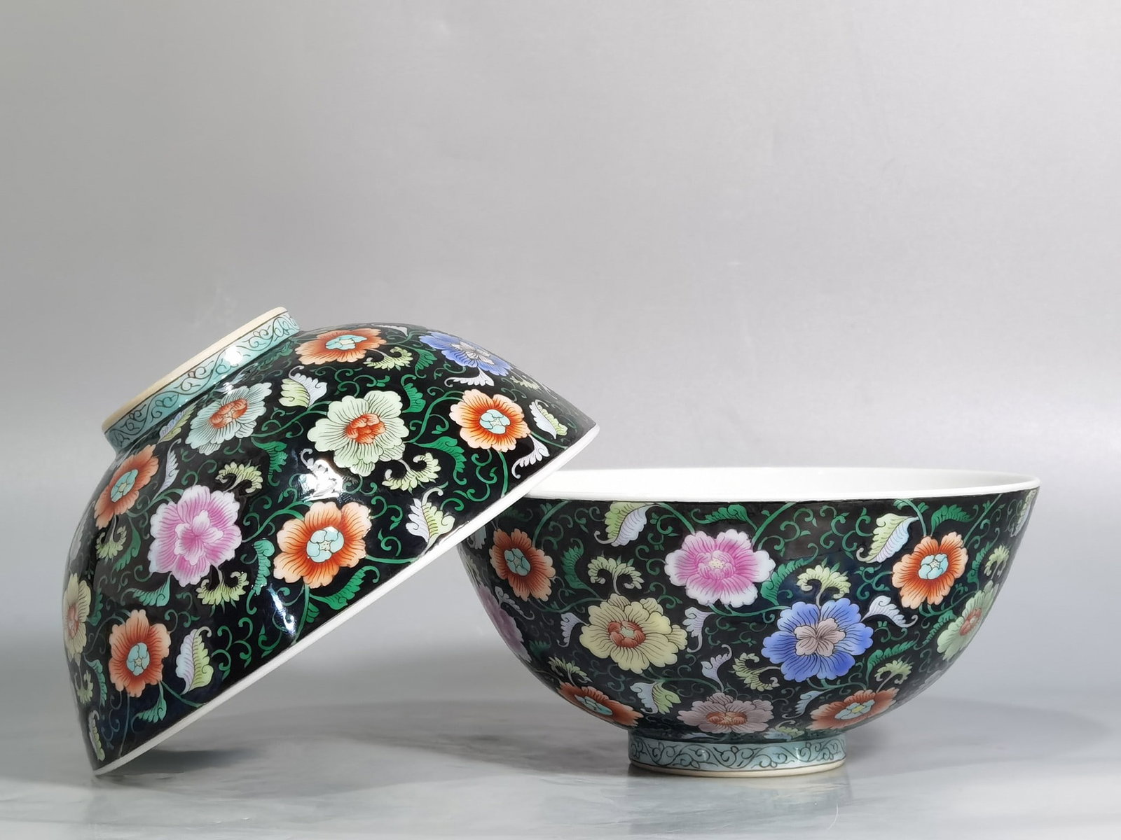 A Pair of Exquisite Black Ground Famille-Rose Lotus Pattern Bowls: A Pair of Exquisite Black Ground Famille-Rose Lotus Pattern Bowls,Qing Dynasty,China,Yongzheng Six-character Mark,Size:5.6inx2.6in