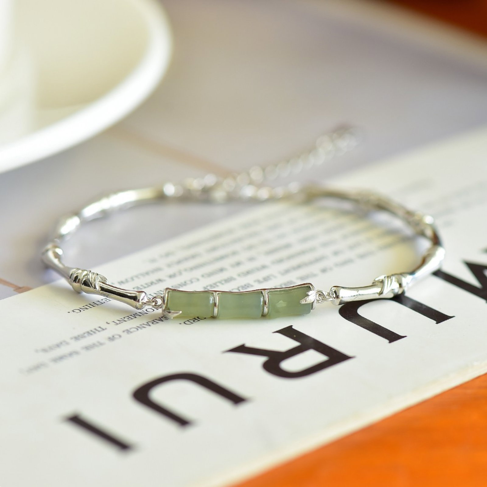 An Exquisite Sterling Silver Inlaid Greenish Jade Bamboo Pattern Bracelet: An Exquisite Sterling Silver Inlaid Greenish Jade Bamboo Pattern Bracelet,Size:0.2inx0.3in 纯银镶青玉竹纹手镯