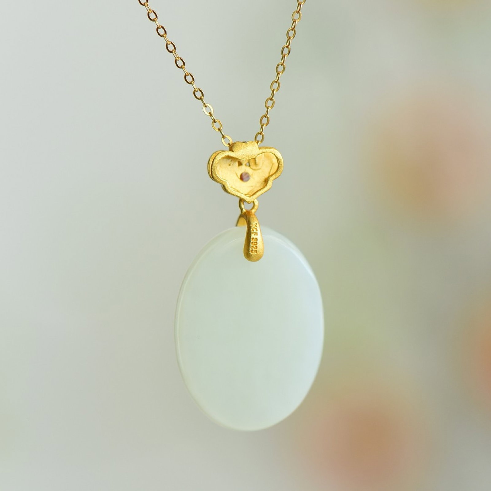 An Exquisite Sterling Silver-Gold Plated Inlaid White Jade Pendant: An Exquisite Sterling Silver-Gold Plated Inlaid White Jade Pendant 纯银镀金镶白玉吊坠