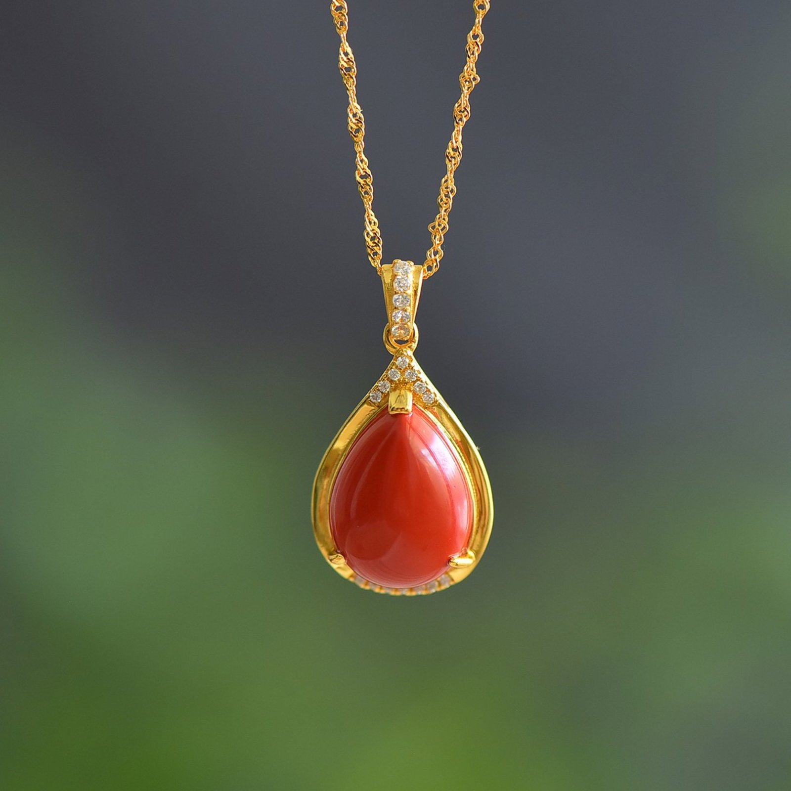An Exquisite Sterling Silver-Gold Plated Inlaid Cinnabar Pendant: An Exquisite Sterling Silver-Gold Plated Inlaid Cinnabar Pendant,Size:0.5inx0.6in 纯银镀金镶朱砂吊坠