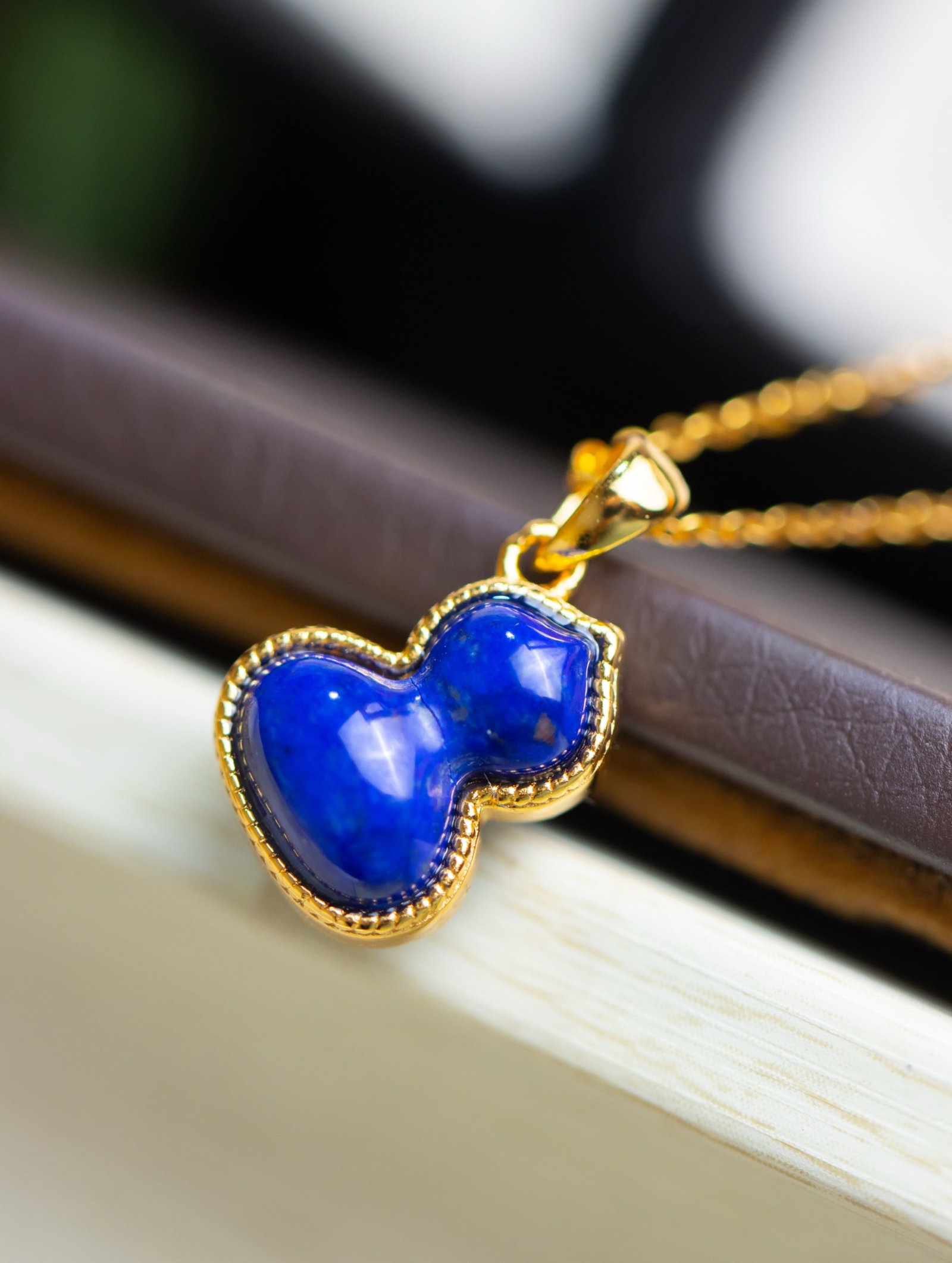 An Exquisite Sterling Silver-Gold Plated Inlaid Lapis Lazuli Gourd Pendant: An Exquisite Sterling Silver-Gold Plated Inlaid Lapis Lazuli Gourd Pendant 纯银镀金镶青金石葫芦吊坠