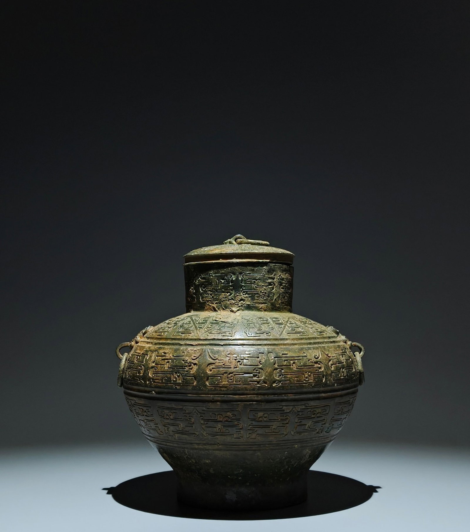 An Archaic Bronze Beast-Ears Geometry Pattern Food Vessel: An Archaic Bronze Beast-Ears Geometry Pattern Food Vessel,the Warring States period in China,Size:9.1inx7.9in 青铜兽耳几何纹食器,中国&