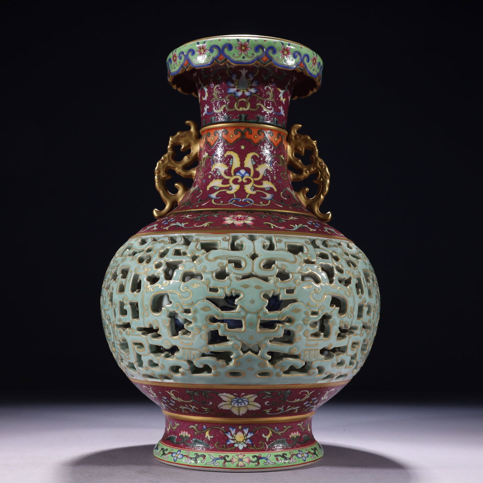 An Exquisite Ruby Red-Glazed Enamel Painted Gold Lotus Pattern Double-Ears Vase: An Exquisite Ruby Red-Glazed Enamel Painted Gold Lotus Pattern Double-Ears Vase,Qing Dynasty,China,Qianlong Six-character Mark,Size:7.5inx13in,Weight:3100g 胭脂红珐琅