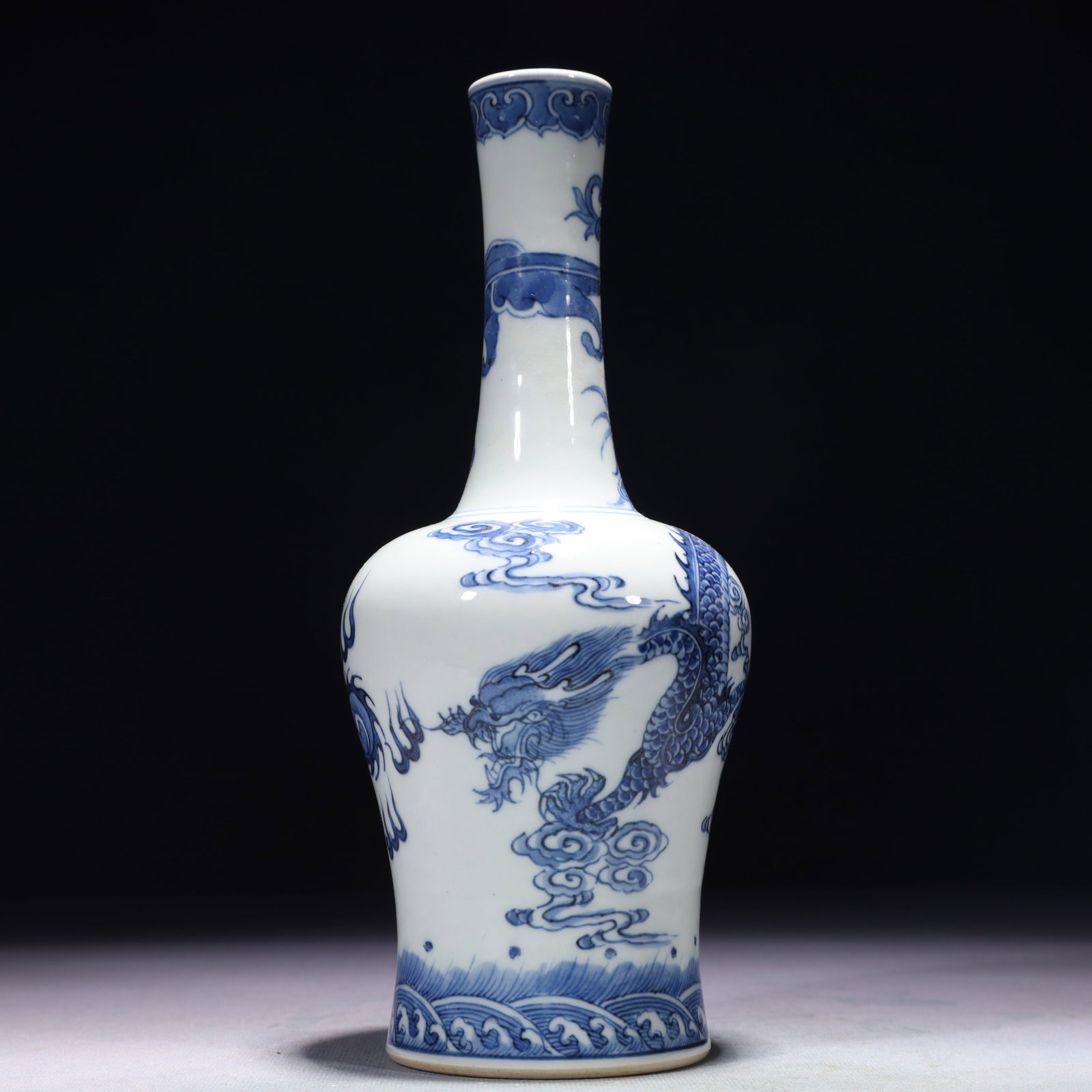 An Exquisite Blue and White Auspicious Cloud and Dragon Pattern Vase: An Exquisite Blue and White Auspicious Cloud and Dragon Pattern Vase,Qing Dynasty,China,Kangxi Six-character Mark,Size:3.5inx9.4in,Weight:450g