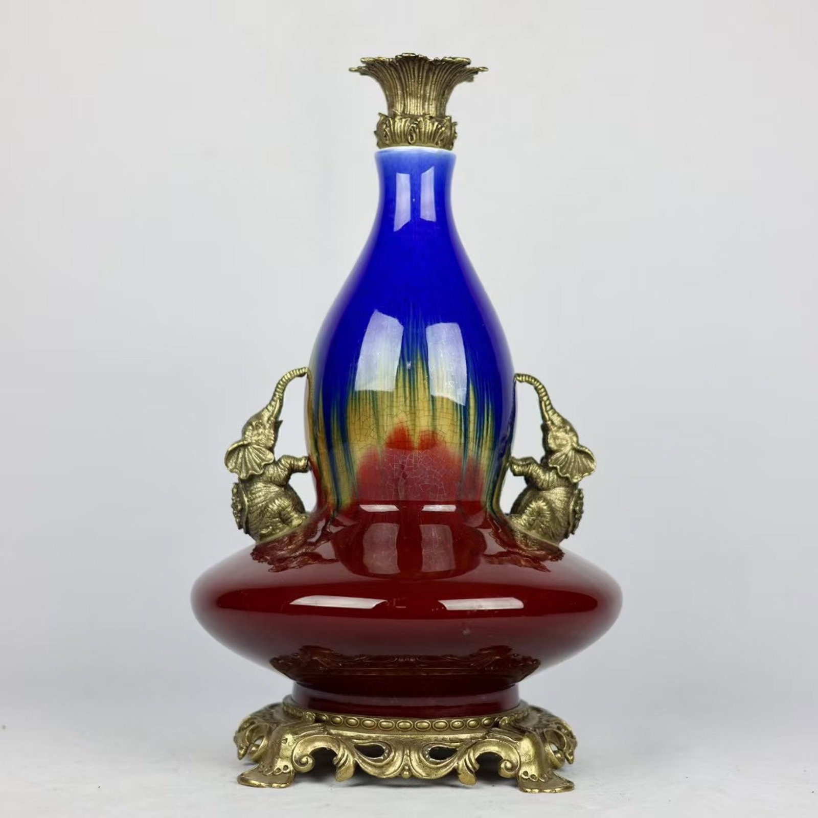 A Huge Flambe Glazed Inlaid Bronze Elephant-Ears Gourd-Shaped Vase: A Huge Flambe Glazed Inlaid Bronze Elephant-Ears Gourd-Shaped Vase,Qing Dynasty,China,Qianlong Six-character Mark,Size:17.7inx9.1in 窑变釉镶铜象耳葫!