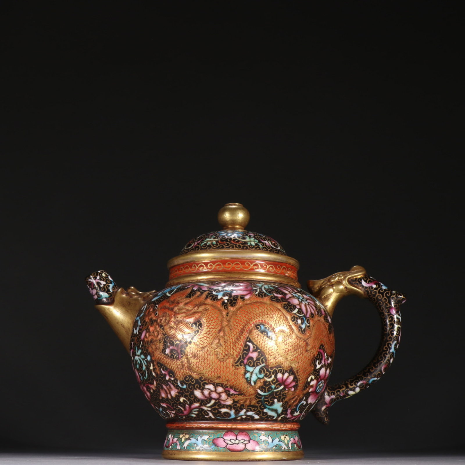 A Rare Purple Sands Enamel Painted Gold Lotus,Dragon and Phoenix Pattern Teapot: A Rare Purple Sands Enamel Painted Gold Lotus,Dragon and Phoenix Pattern Teapot,Qing Dynasty,China,Kangxi Four-character Mark,Size:5.9inx7.4in