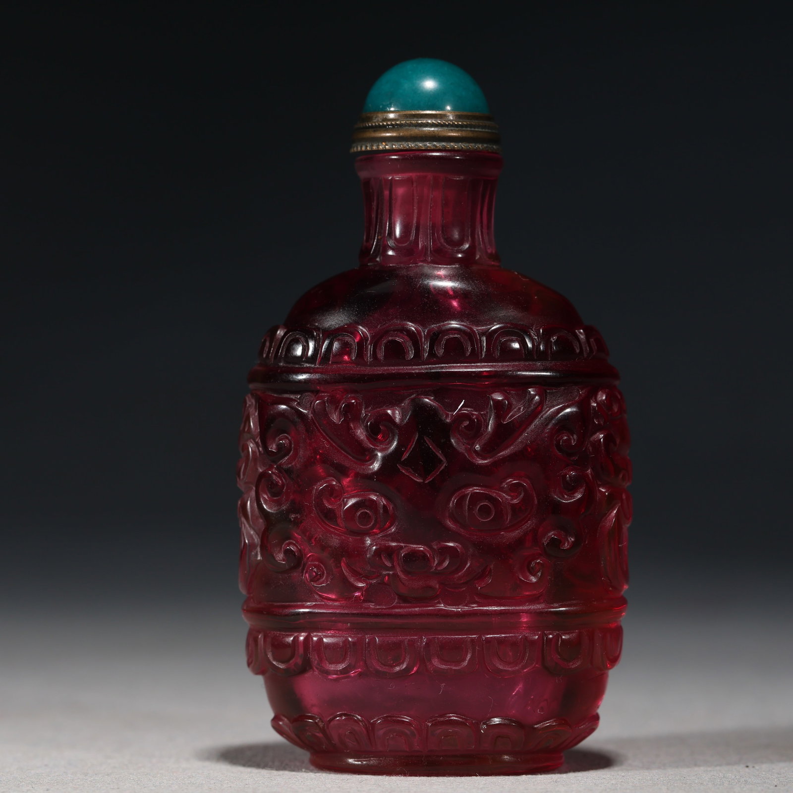 An Exquisite Pink Glass Animal Mask Taotie Pattern Snuff Bottle: An Exquisite Pink Glass Animal Mask Taotie Pattern Snuff Bottle,Qing Dynasty, China,Qianlong Four-character Mark,Size:1.8in×0.8in×3.1in