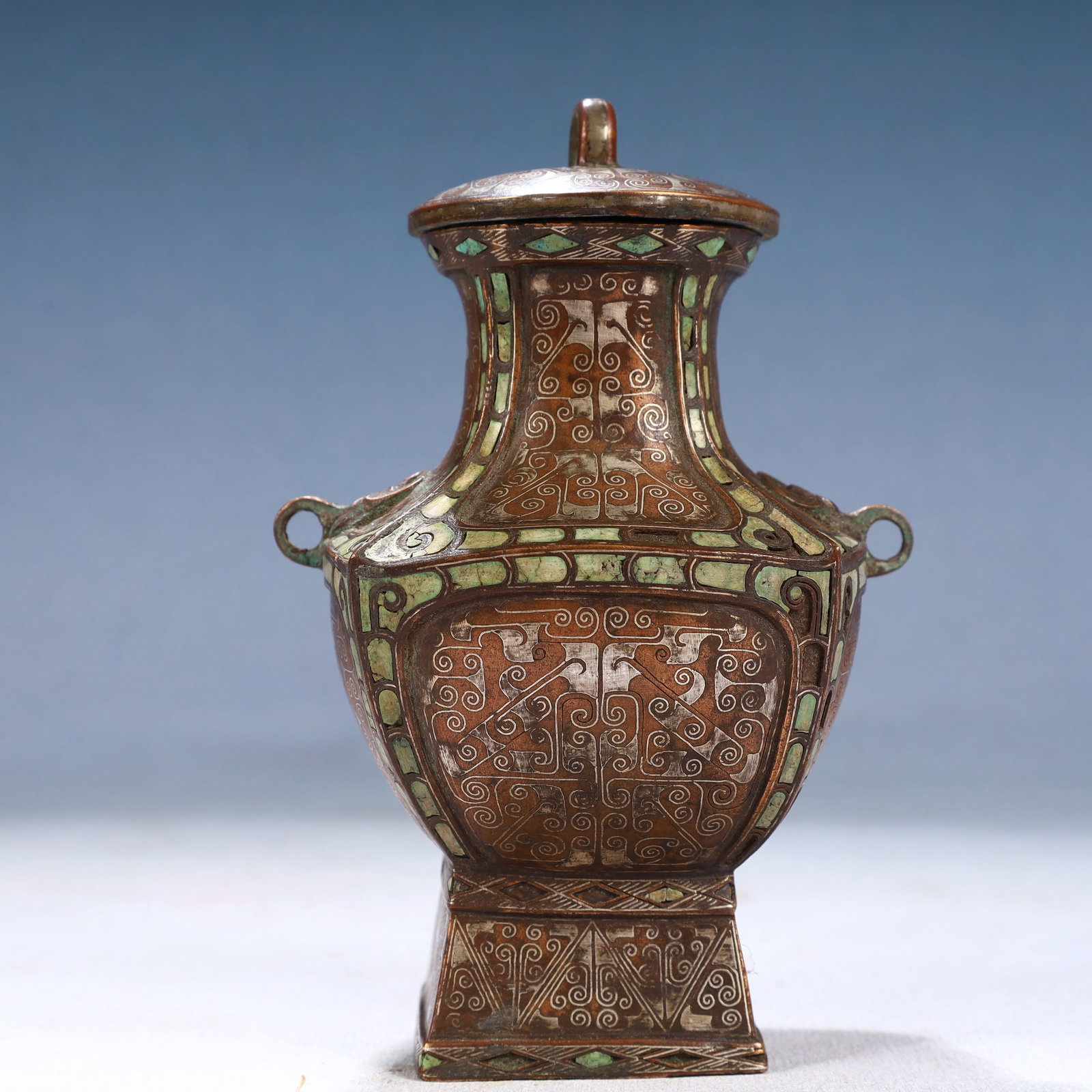 An Exquisite Bronze Inlaid Gold and Silver Ruyi Pattern Beast-Ears Bottle: An Exquisite Bronze Inlaid Gold and Silver Ruyi Pattern Beast-Ears Bottle,Qing Dynasty, China,Size:3.5inx5.1in,Weight:600g 铜错金银如意纹兽耳İ