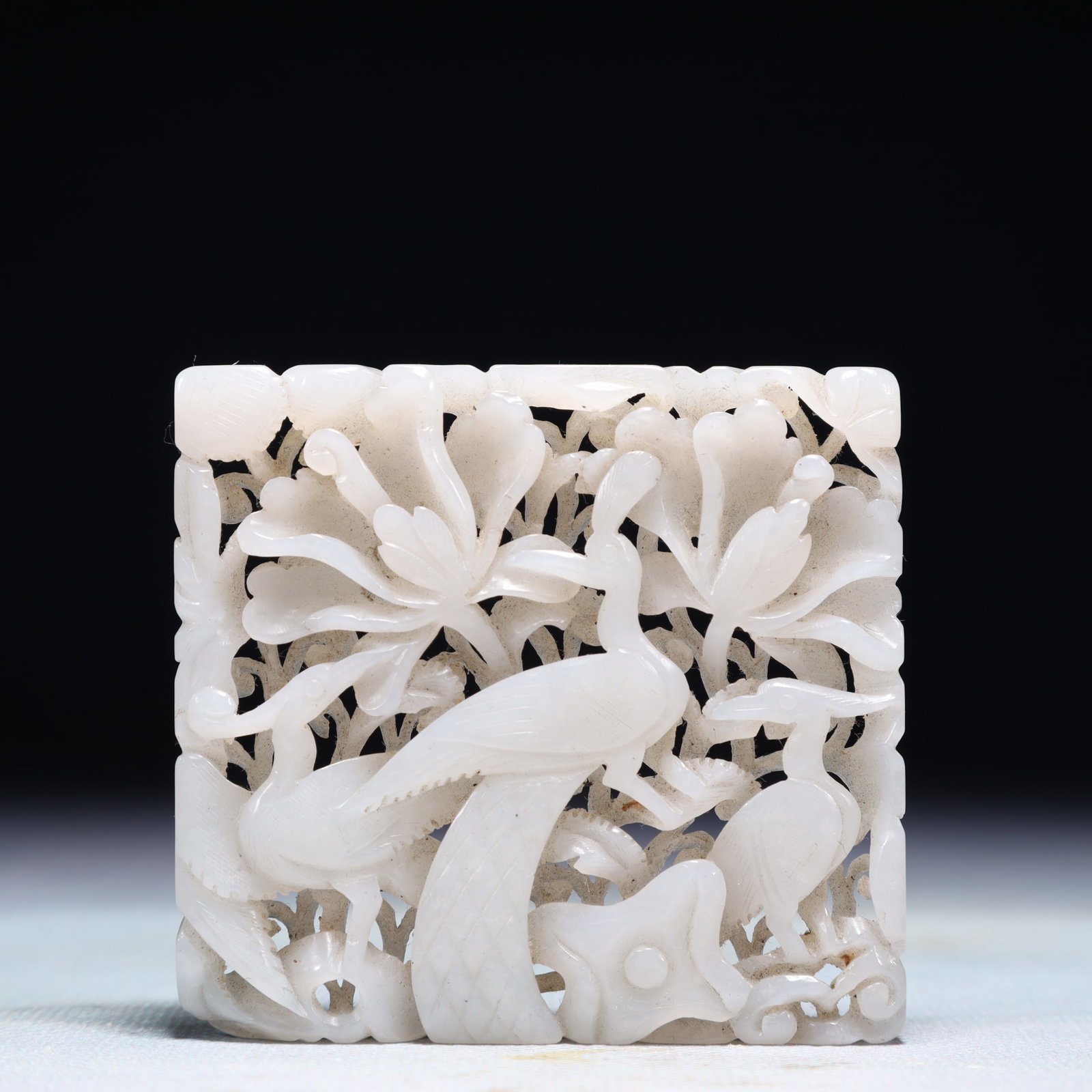 An Exquisite White Jade Flower and Bird Pattern Pendant: An Exquisite White Jade Flower and Bird Pattern Pendant,Qing Dynasty,China,Size:2.8inx2.6in,Weight:61.5g 白玉花鸟纹佩,中国清代
