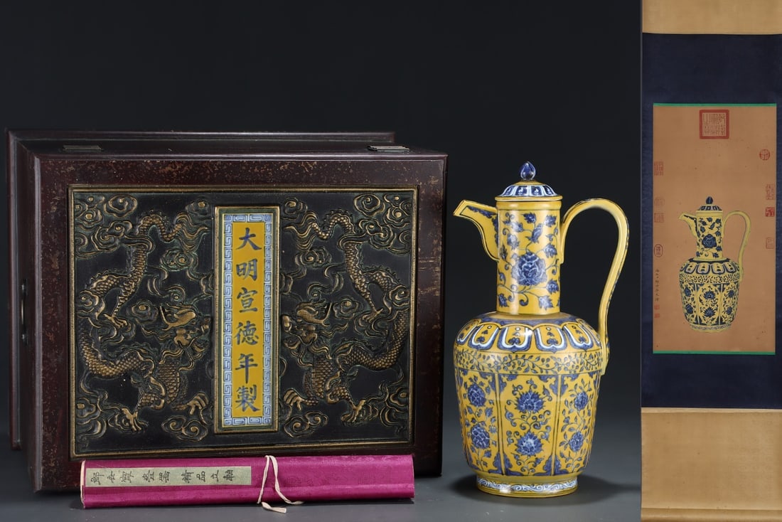 A Rare Yellow-glazed blue and white ewer decorated with flower sprays, with a silk painting hanging: A Rare Yellow-glazed blue and white ewer decorated with flower sprays, with a silk painting hanging scroll,Ming Dynasty, China,Size:15.6inx8.3in,(Without frame)25inx12.6in 黄釉青!