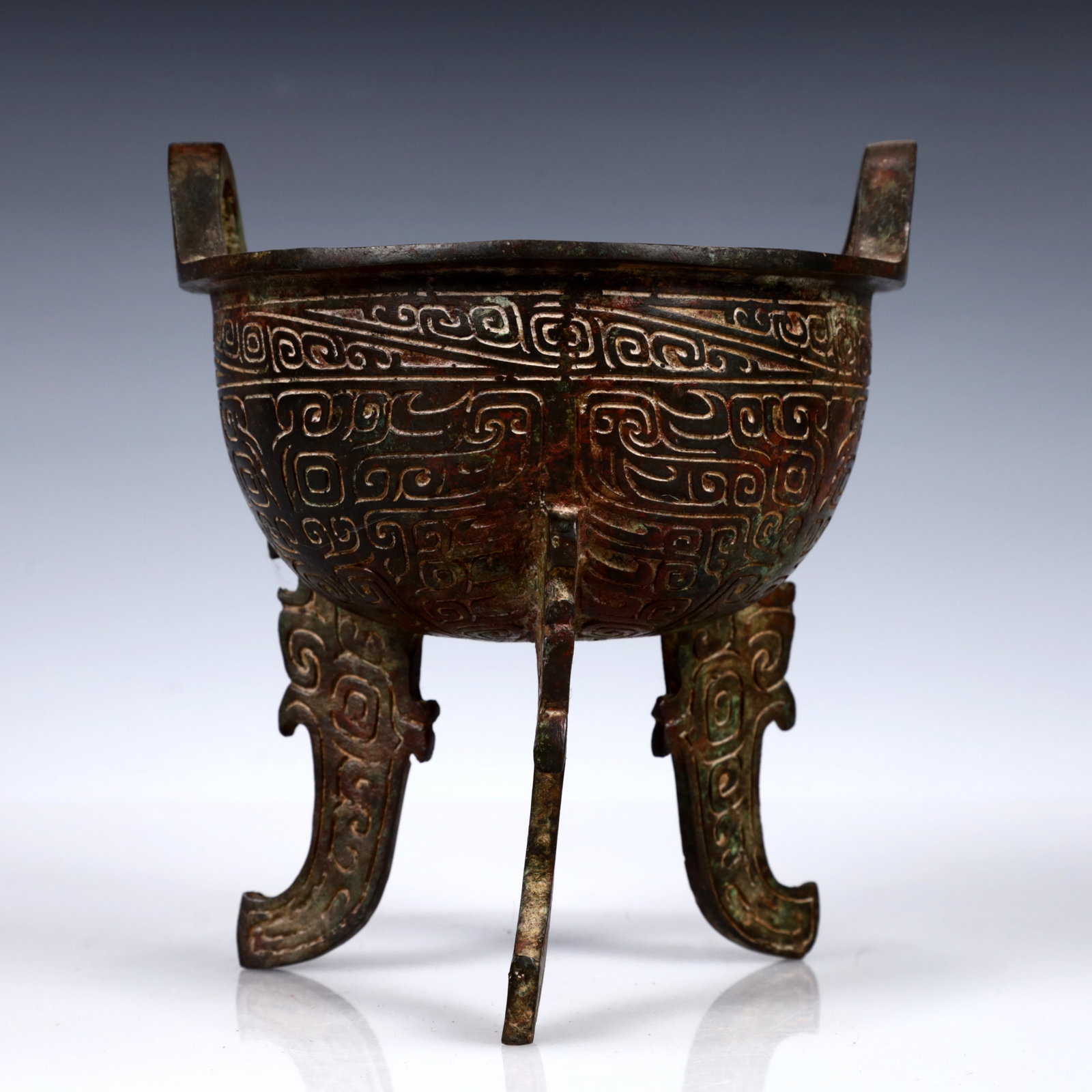 A Rare Bronze Double-Ears and Tripod Ding (1 of 12)