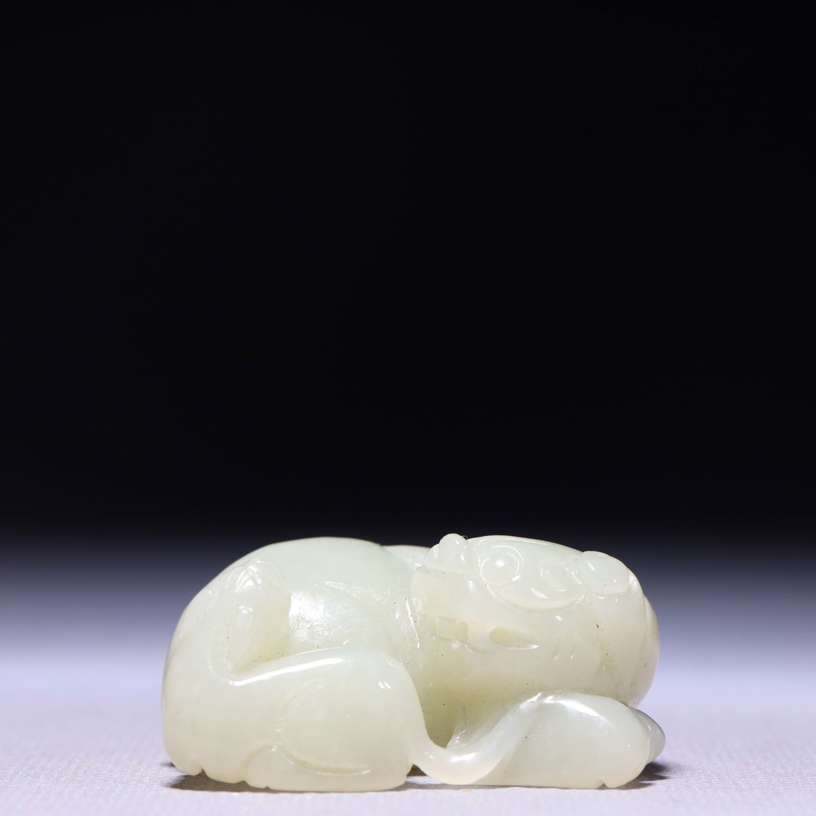 An Exquisite White Jade Lion Ornament (1 of 9)