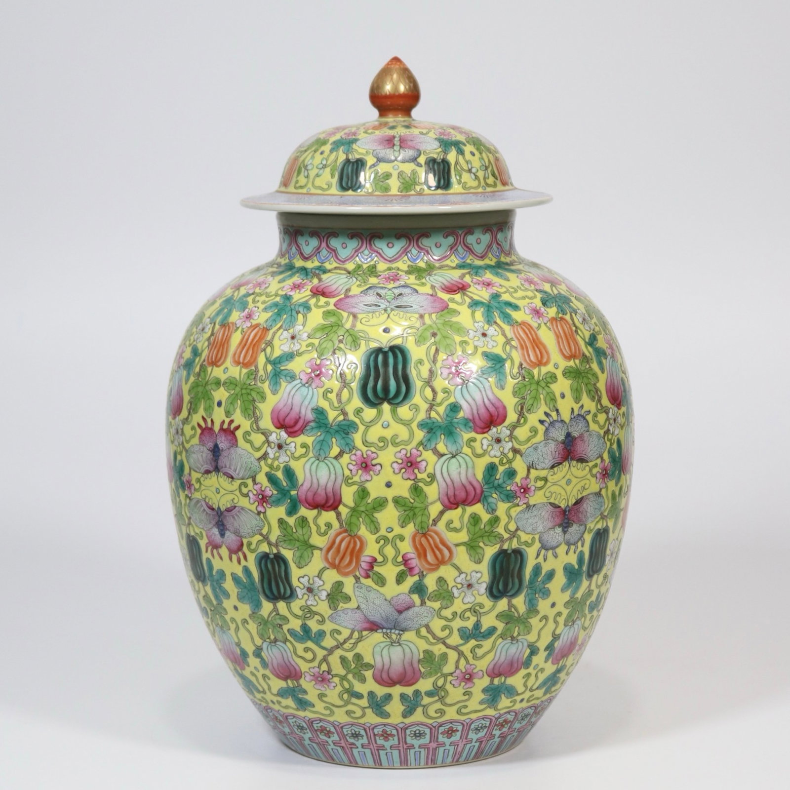 A Rare Yellow Ground Famille-Rose Melon and Fruit Pattern Jar with Cover: A Rare Yellow Ground Famille-Rose Melon and Fruit Pattern Jar with Cover,Qing Dynasty,China,Jiaqing Six-character Mark,Size:12.2inx4.1in 黄地粉彩瓜果纹盖