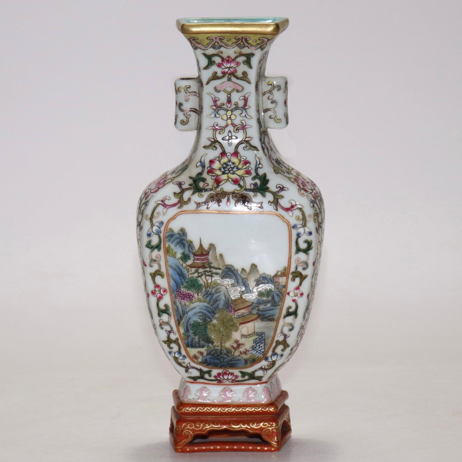 A fine scrolling floral wall vase with reserved landscape panel: A fine scrolling floral wall vase with reserved landscape panel, Qing Dynasty, China, with six-character Qianlong reign mark, Size:9inx3.9in 缠枝花卉开窗山