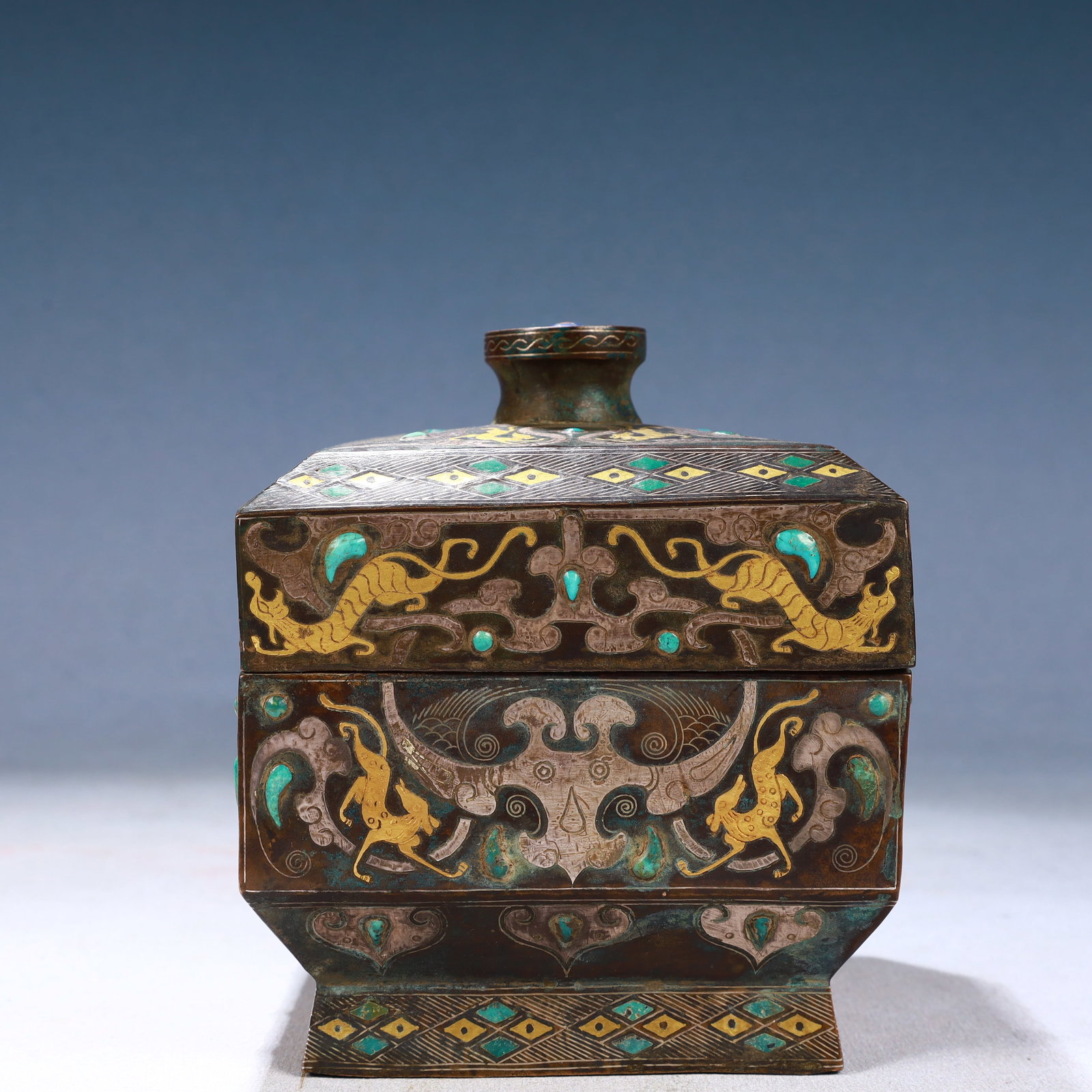 An Exquisite Bronze Inlaid Gold and Silver Auspicious Beast Pattern Beast-Ears Bottle: An Exquisite Bronze Inlaid Gold and Silver Auspicious Beast Pattern Beast-Ears Bottle,Qing Dynasty, China,Size:4.7inx5.9in,Weight:1750g 铜错金银瑞兽纹兽