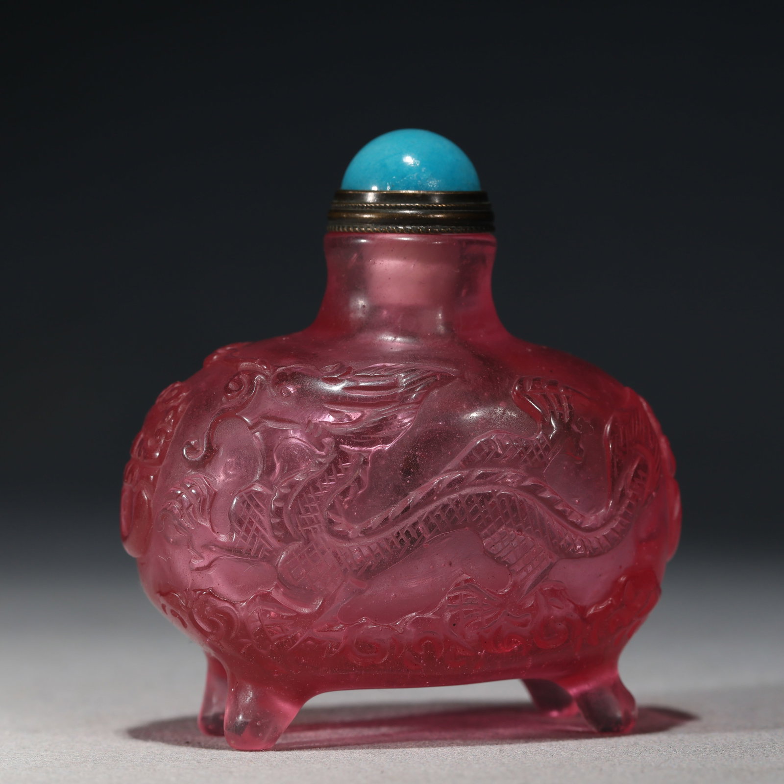 An Exquisite Pink Glass Dragon and Phoenix Auspicious Pattern Snuff Bottle: An Exquisite Pink Glass Dragon and Phoenix Auspicious Pattern Snuff Bottle,Qing Dynasty, China,Qianlong Four-character Mark,Size:2.6in×1.4in×2.8in