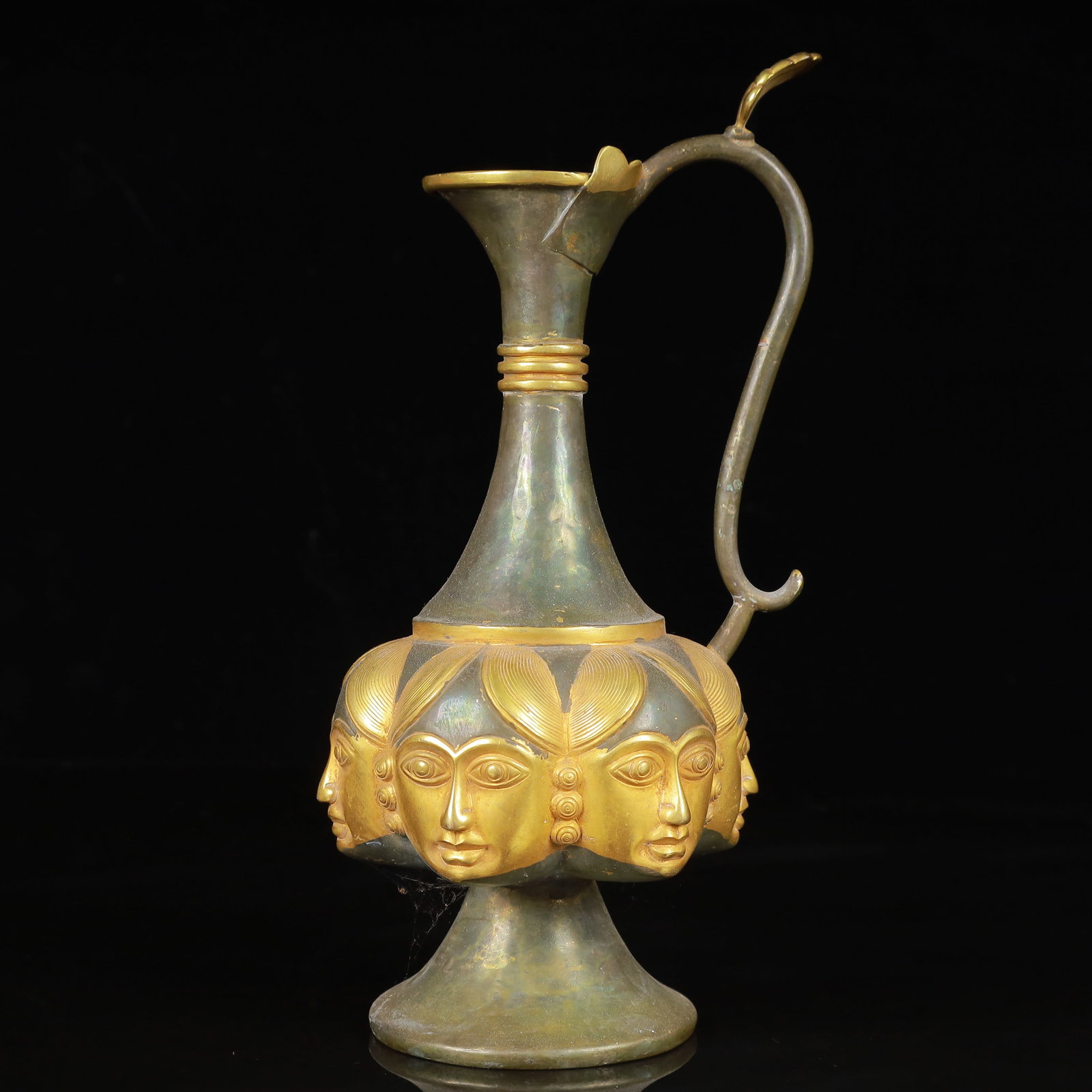 An Exquisite Gilt Silver Figure-Face Pattern Ewer: An Exquisite Gilt Silver Figure-Face Pattern Ewer,Qing Dynasty,China,Size:4.7inx9.1in,Weight:700g 银鎏金人面纹执壶,中国清代
