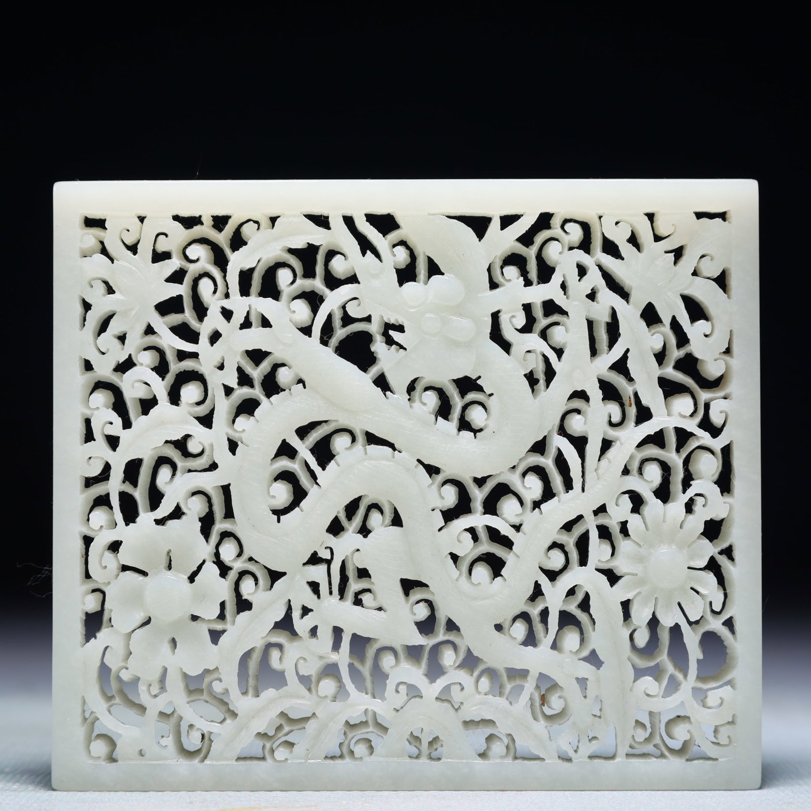 An Exquisite White Jade Dragon Pattern Pendant: An Exquisite White Jade Dragon Pattern Pendant,Qing Dynasty,China,Size:3.9inx3.3in,Weight:136g 白玉龙纹佩,中国清代